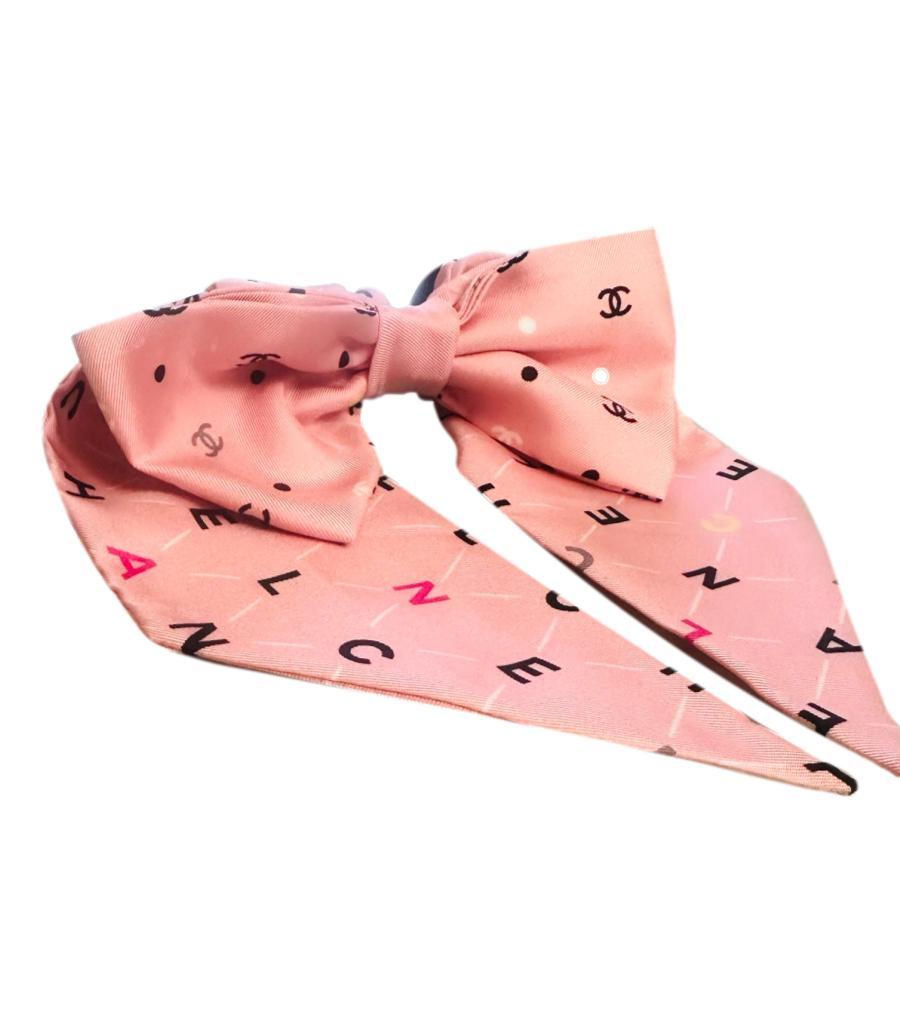 Chanel Silk 'CC' Logo Bow Hair Accessory<Silk ponytail scrunchie with a large oversized bow in pink and having the wording 'Chanel', 'CC' logos and 'polka dots'
Size -One Size
Condition - Excellent
Composition - Silk
Comes With - Hair Accessory 