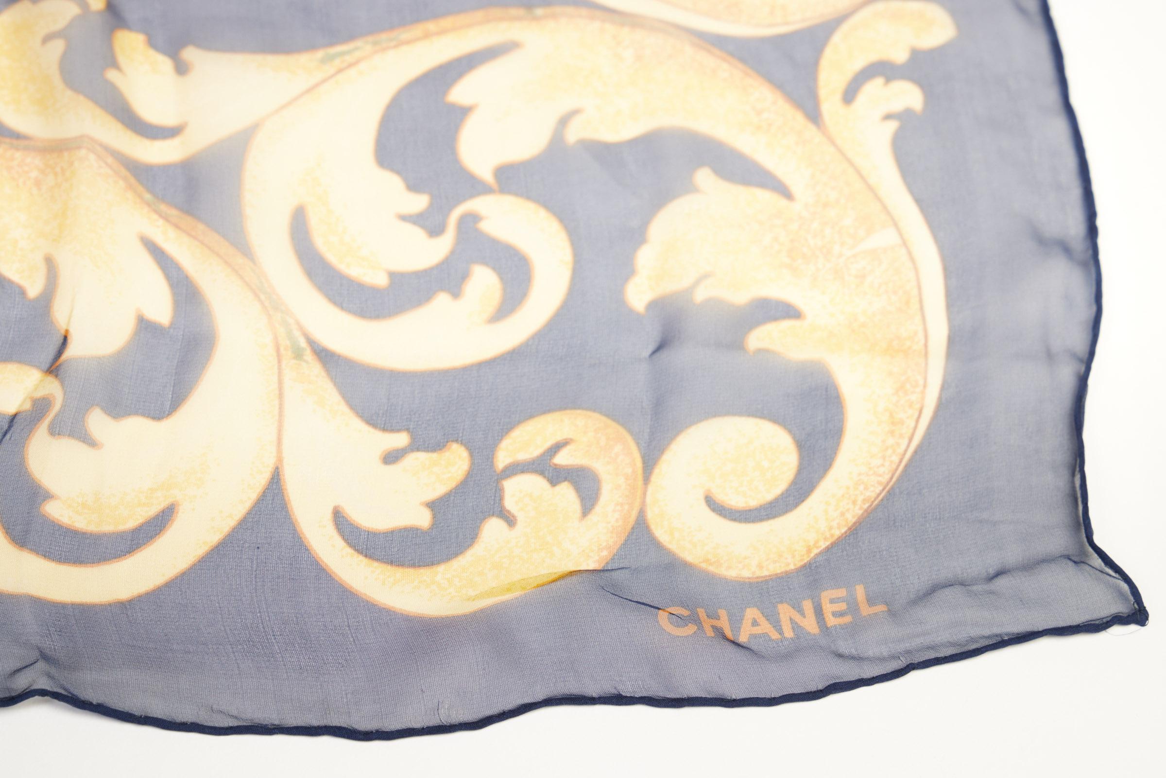 Chanel vintage blue silk chiffon scarf with yellow sunflowers design. Hand rolled edges. Original care tag.