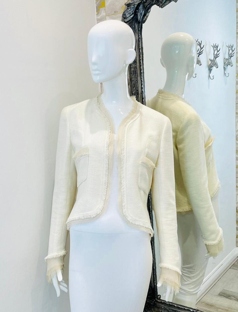 Chanel Silk Fringe Trimmed Cotton Jacket

Ivory open jacket designed with tonal triple layer silk and fringe trims.

Detailed with high-low hem, long sleeves and open pockets to the sides.

From 2004 Cruise Collection.

Size – 42FR

Condition – Very