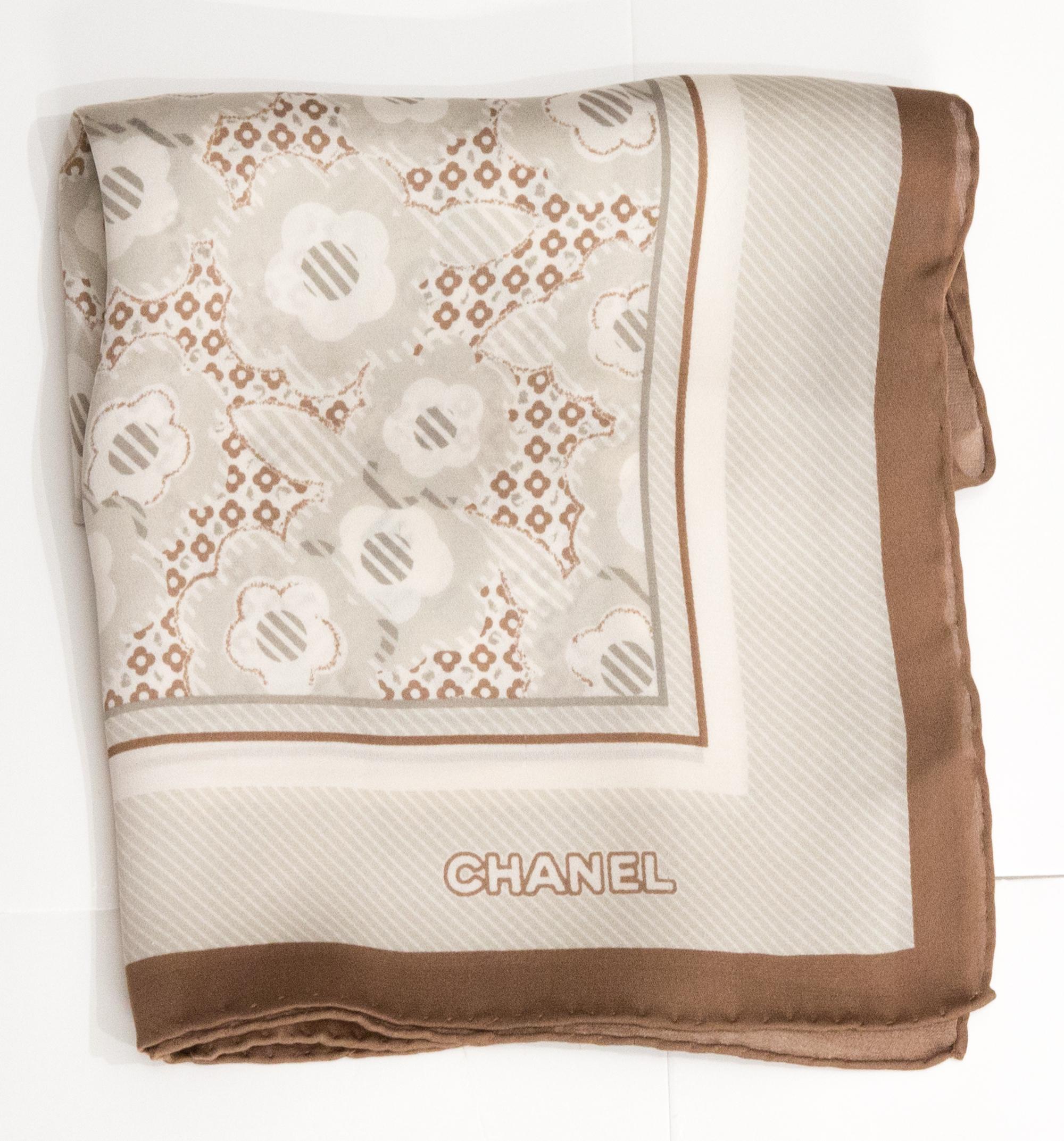 Chanel silk scarf featuring a brown border and a top logo signature. 
Circa 2000s
Composition: 100% silk. 
In good vintage condition. Made in France.
23.6in. (60cm) X 23.6in. (60cm)
We guarantee you will receive this  iconic item as described and