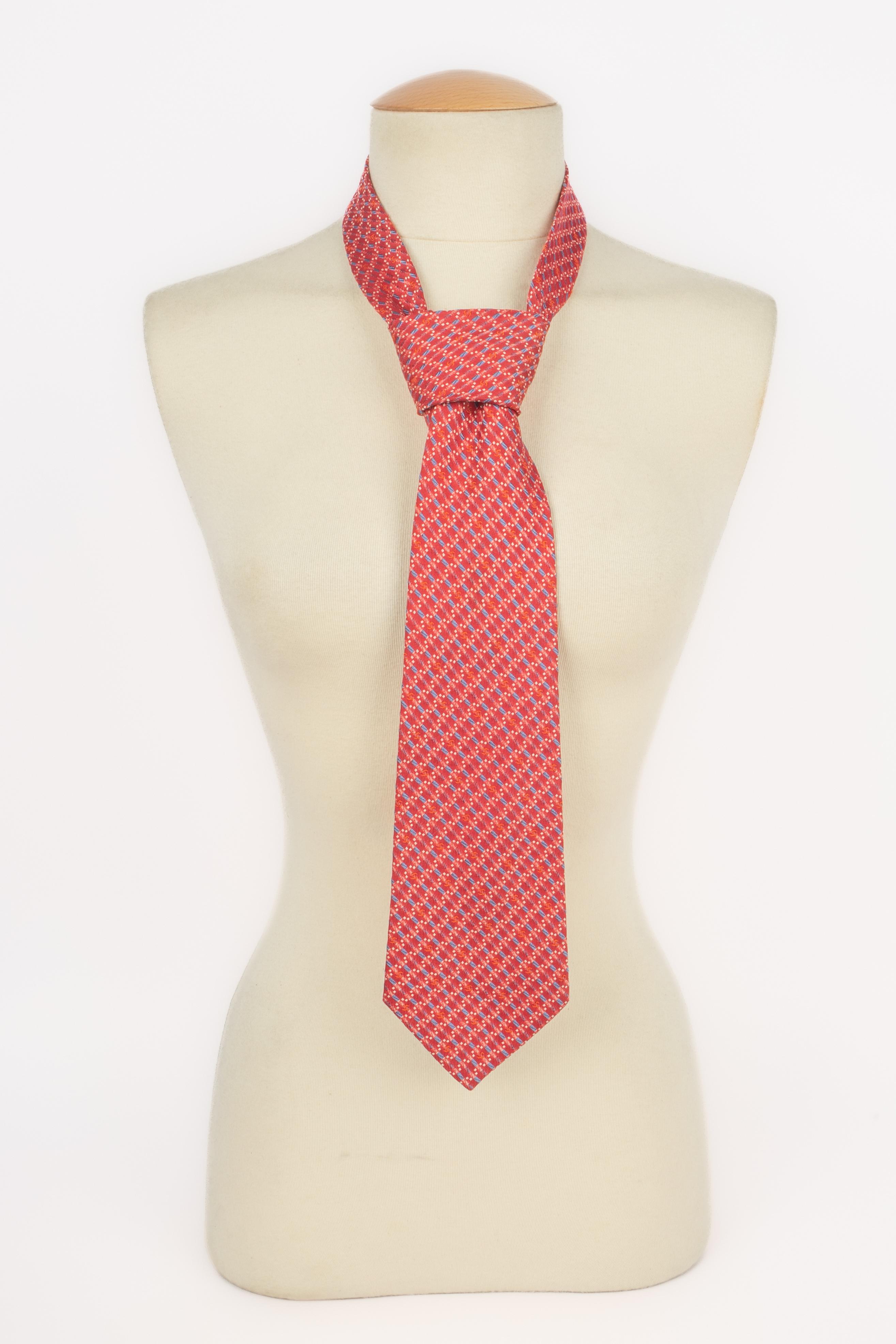 CHANEL - (Made in Italy) Blue and red silk tie.

Condition:
Very good condition

Dimensions:
Width: 10 cm

SKU:ACC76