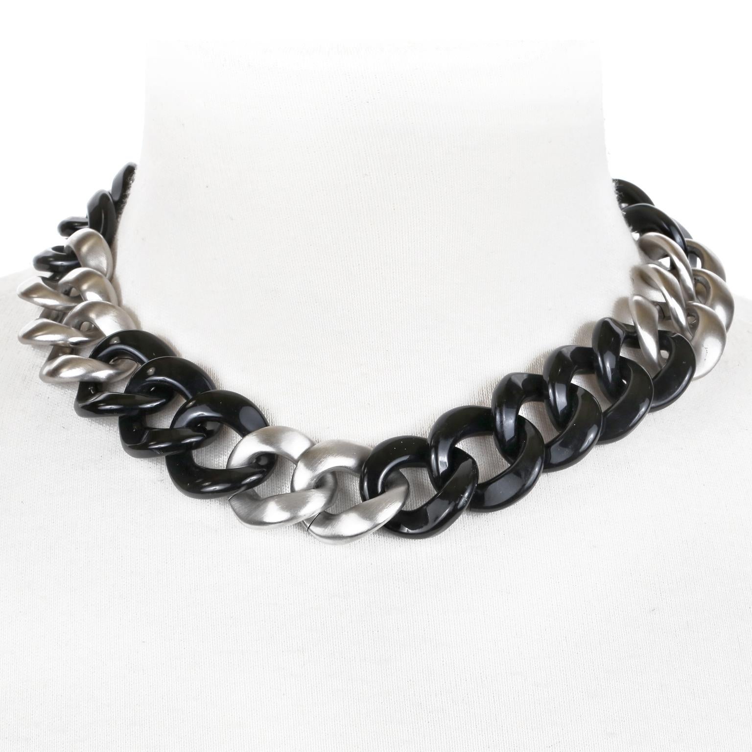 This authentic Chanel Silver and Black Resin Curb Chain CC Choker is in excellent condition.  Matte silver and black resin chunky curb chain design with interlocking CC charm at the clasp.   Approximately 17 inches.  Pouch or box included. 
