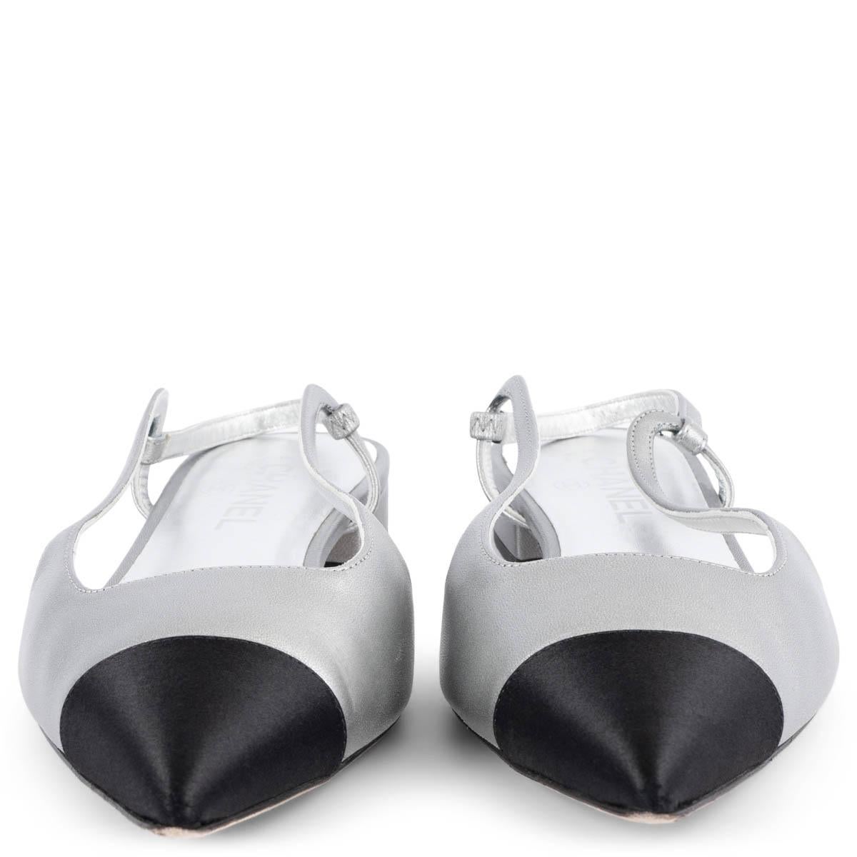 100% authentic Chanel slingback flats in metallic silver lambskin with classic black satin cap toe and silver CC hardware at the back of the heel. Have been worn once or twice and are in excellent condition. Come with dust bag. 

2020