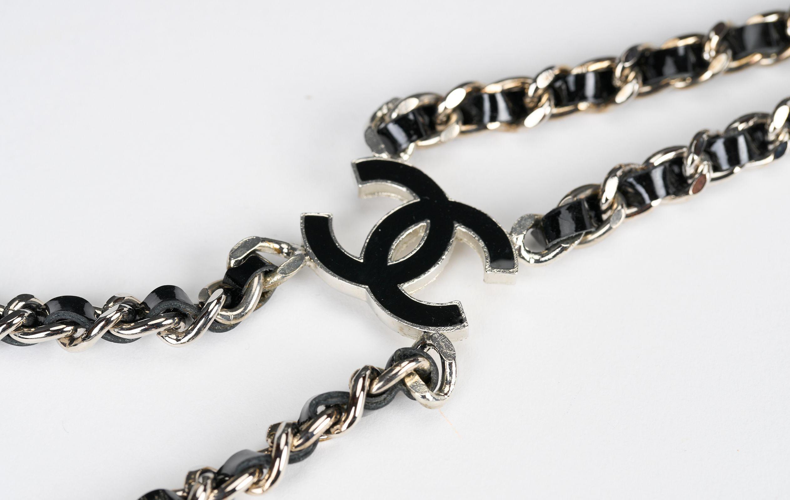 Chanel rare and collectible silver tone suspenders with black woven leather . Adjustable length with two cc logo cursors. 
Comes with original tag, booklet and box.