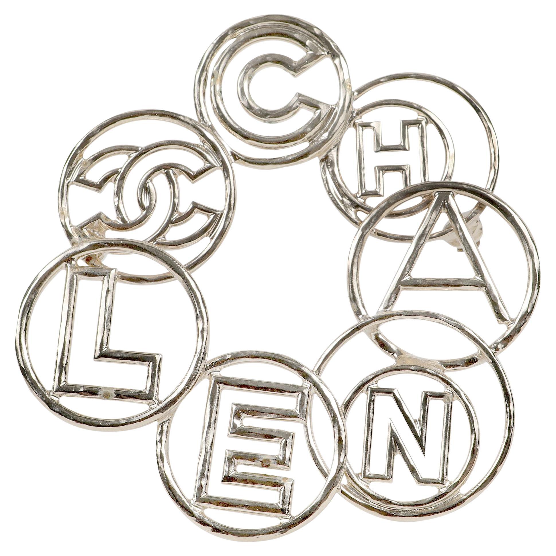 Chanel Silver Bubble Letter Circle Pin For Sale