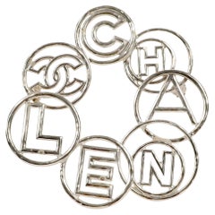 Chanel Silver Bubble Letter Circle Pin