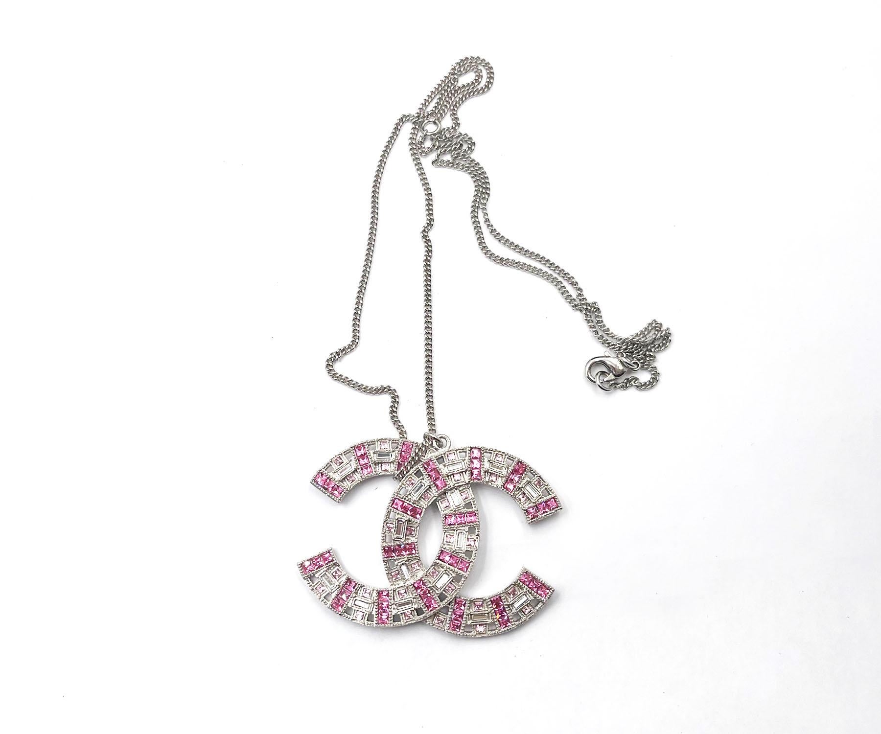 Chanel Classic Silver CC Pink Baguette Crystal Large Pendant Necklace

*Marked 17
*Made in France
*Comes with the original box and pouch

-It is approximately 16