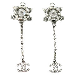 Boucles d'oreilles Pierce CC pointues en cristal flocon de neige de Chanel en argent