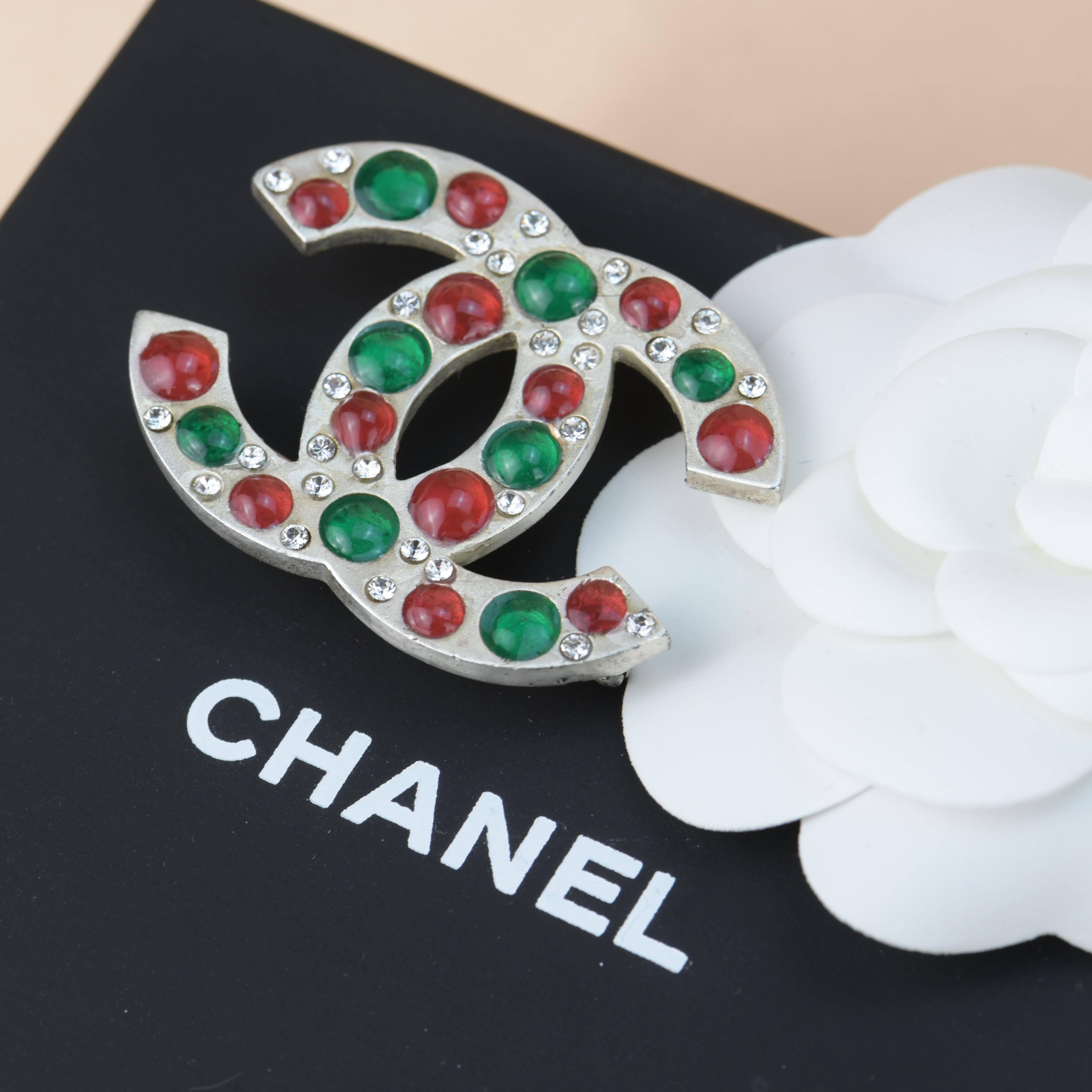 Brand: Chanel 
Period: Approx. 2003
Stamp Date: 03A
Model: Brooch
__________________________________
Metal: Silver Gilt
Stone: Gripoix Glass
Measurement: Approx. 48mm W * 33mm H
Weight: 15g
__________________________________
Condition Excellent