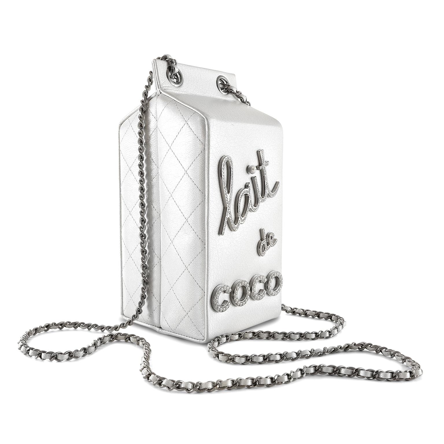 Chanel Lait de Coco Silver Runway Bag- Pristine Condition
From the 2014 collection, it is an extremely rare and collectible item.
Silver iridescent leather milk carton silhouette is embellished with “lait de COCO” lettering in crystal and faux