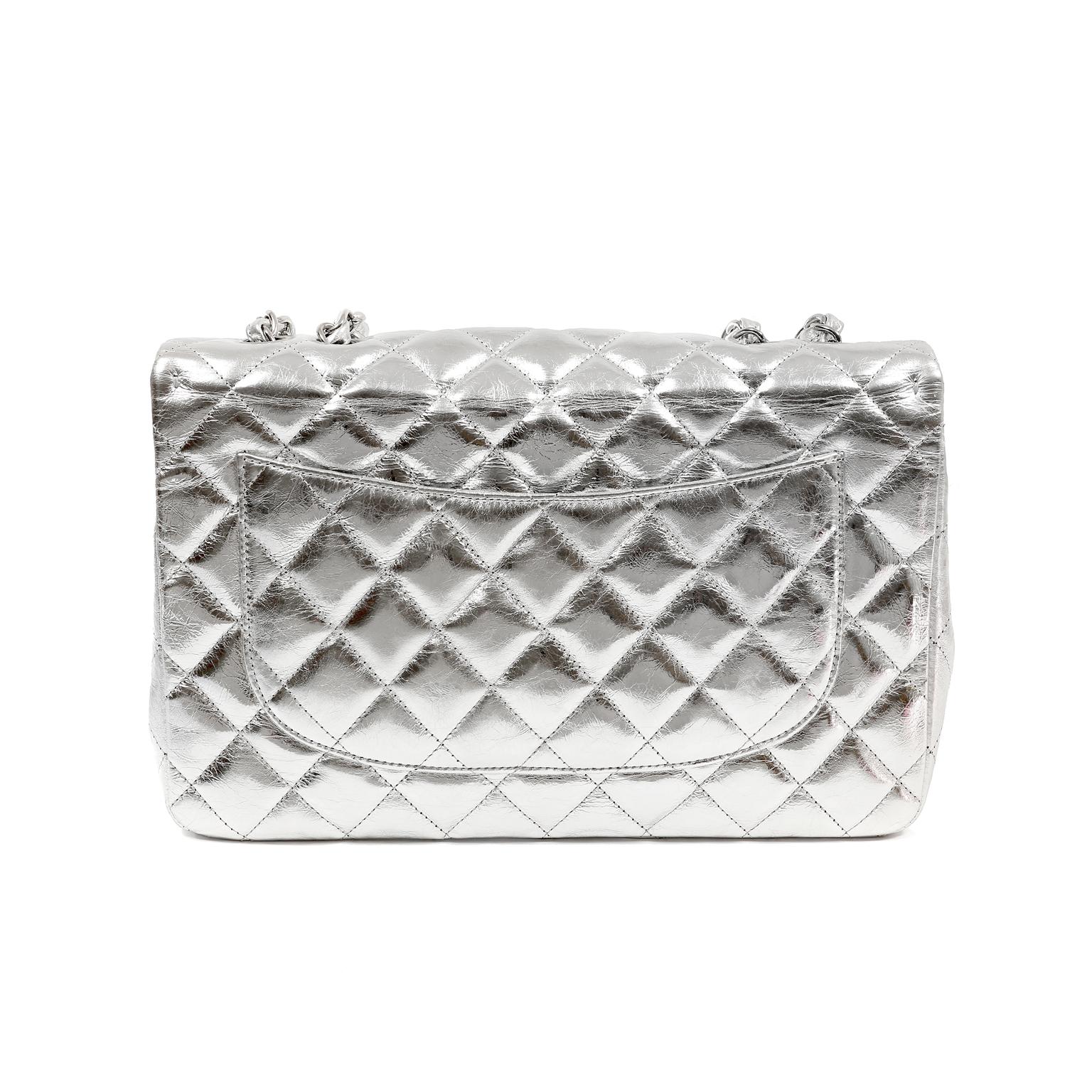 This authentic Chanel Silver Leather Jumbo Classic Flap is in excellent condition.  A truly timeless piece, the Jumbo Classic is certain to hold its value.
Metallic silver foil leather quilted in signature Chanel diamond pattern.  Silver tone