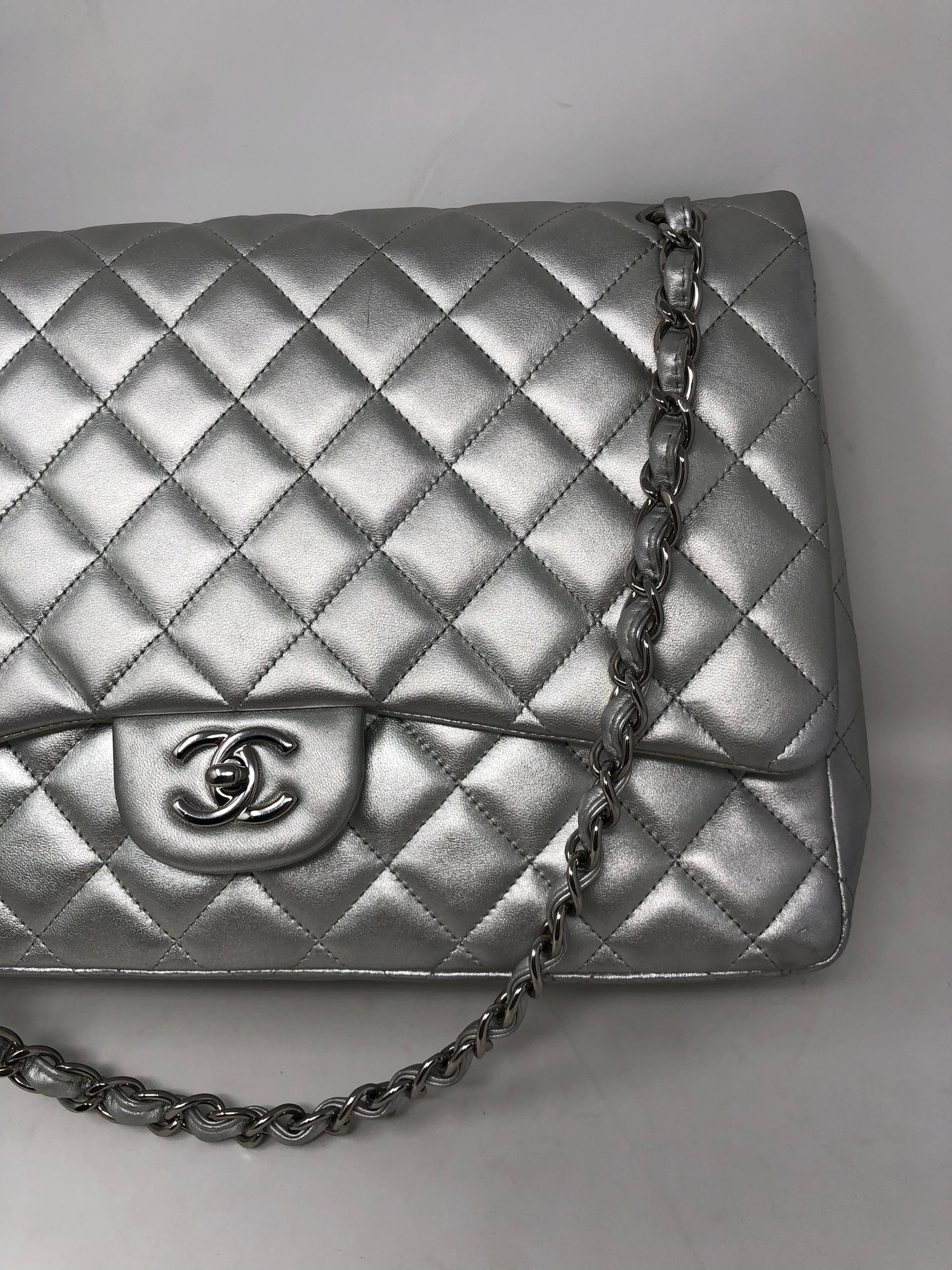 Chanel Silver Maxi Flap Bag. Lambskin metallic silver leather with silver hardware. Great condition. Maxi size 13