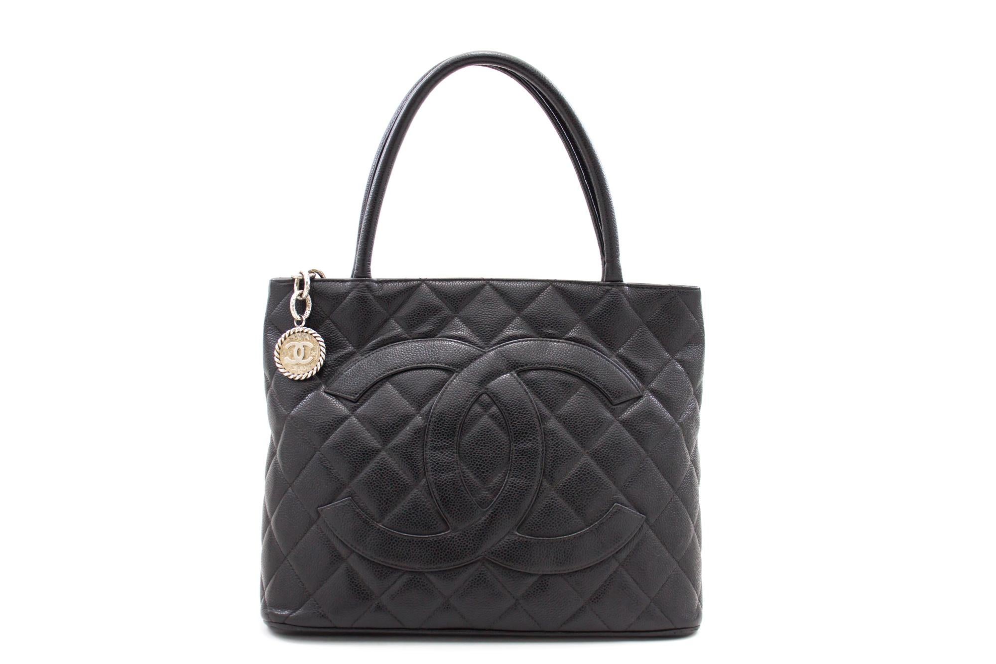 An authentic CHANEL Silver Medallion Caviar Shoulder Bag Shopping Tote Black. The color is Black. The outside material is Leather. The pattern is Solid. This item is Contemporary. The year of manufacture would be 2000-2 0 0 2 .
Conditions &