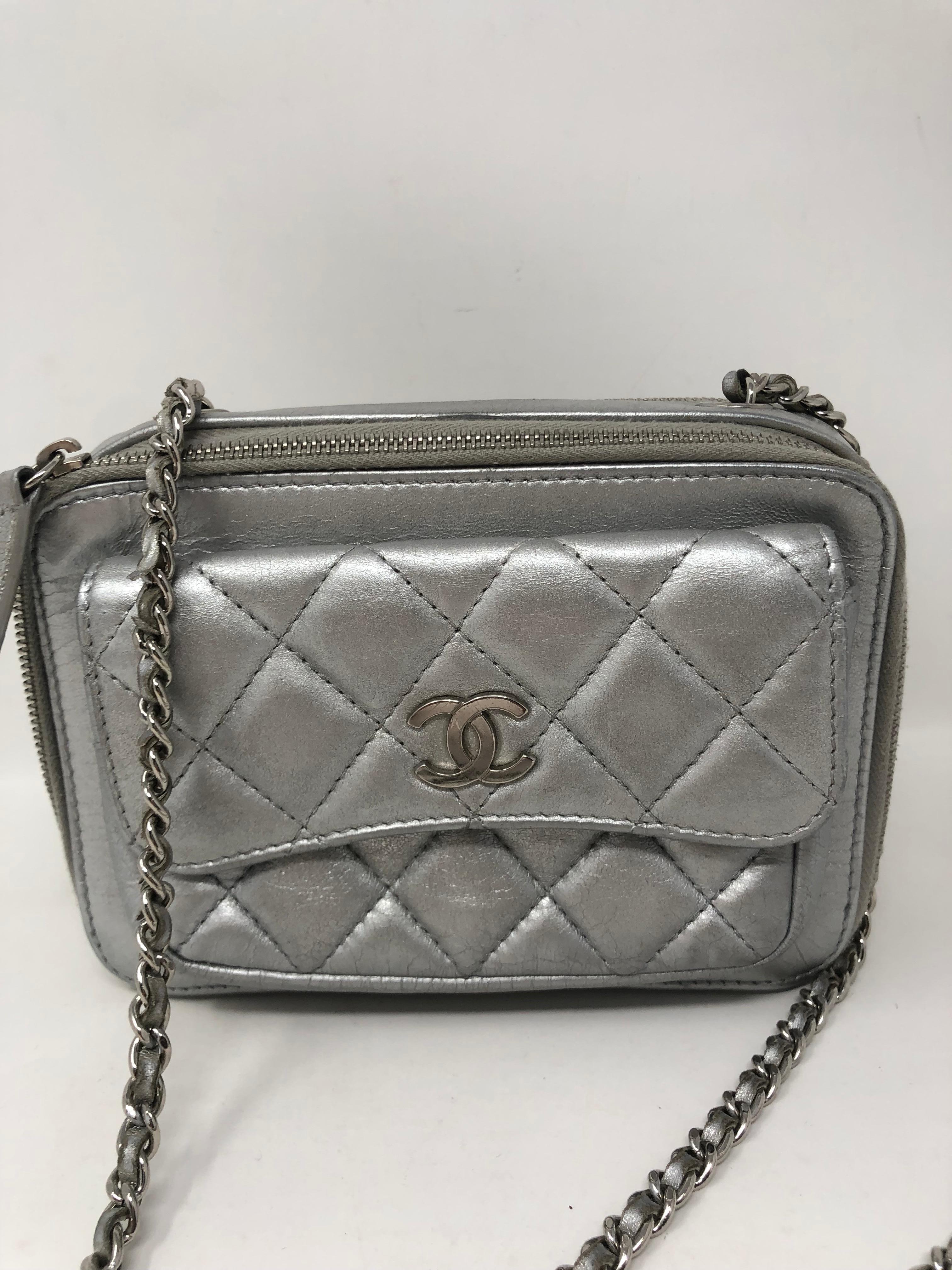 Chanel Silver Metallic Crossbody Camera Bag. Good condition. Light wear. Silver leather with silver chain. Guaranteed authentic. 