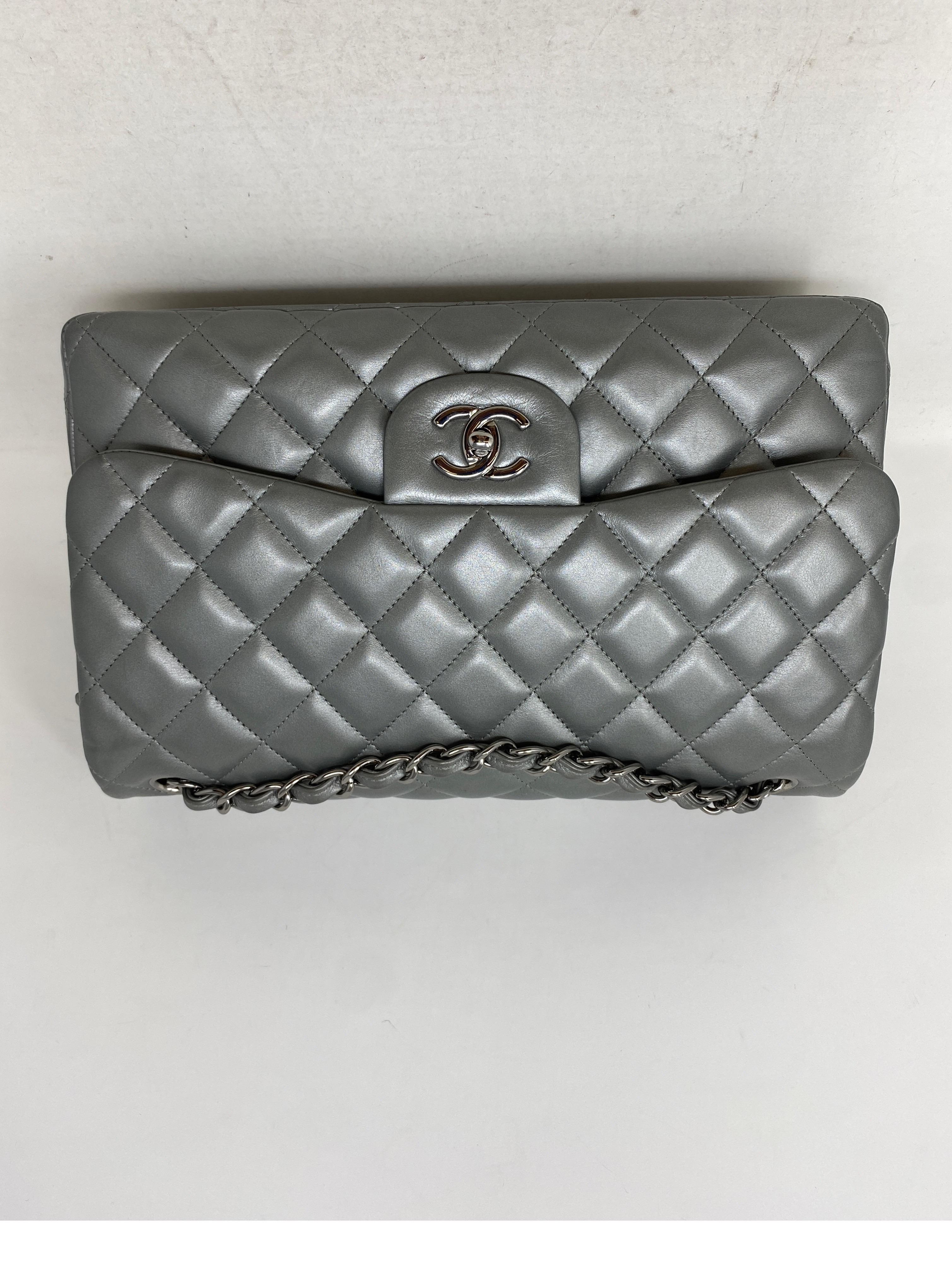 Chanel Silver Metallic Jumbo Double Flap Bag. Excellent condition. Unique silver lambskin leather bag. Silver hardware. Classic style bag with rare silver leather. Collector's piece. Includes dust cover and box. Guaranteed authentic. 