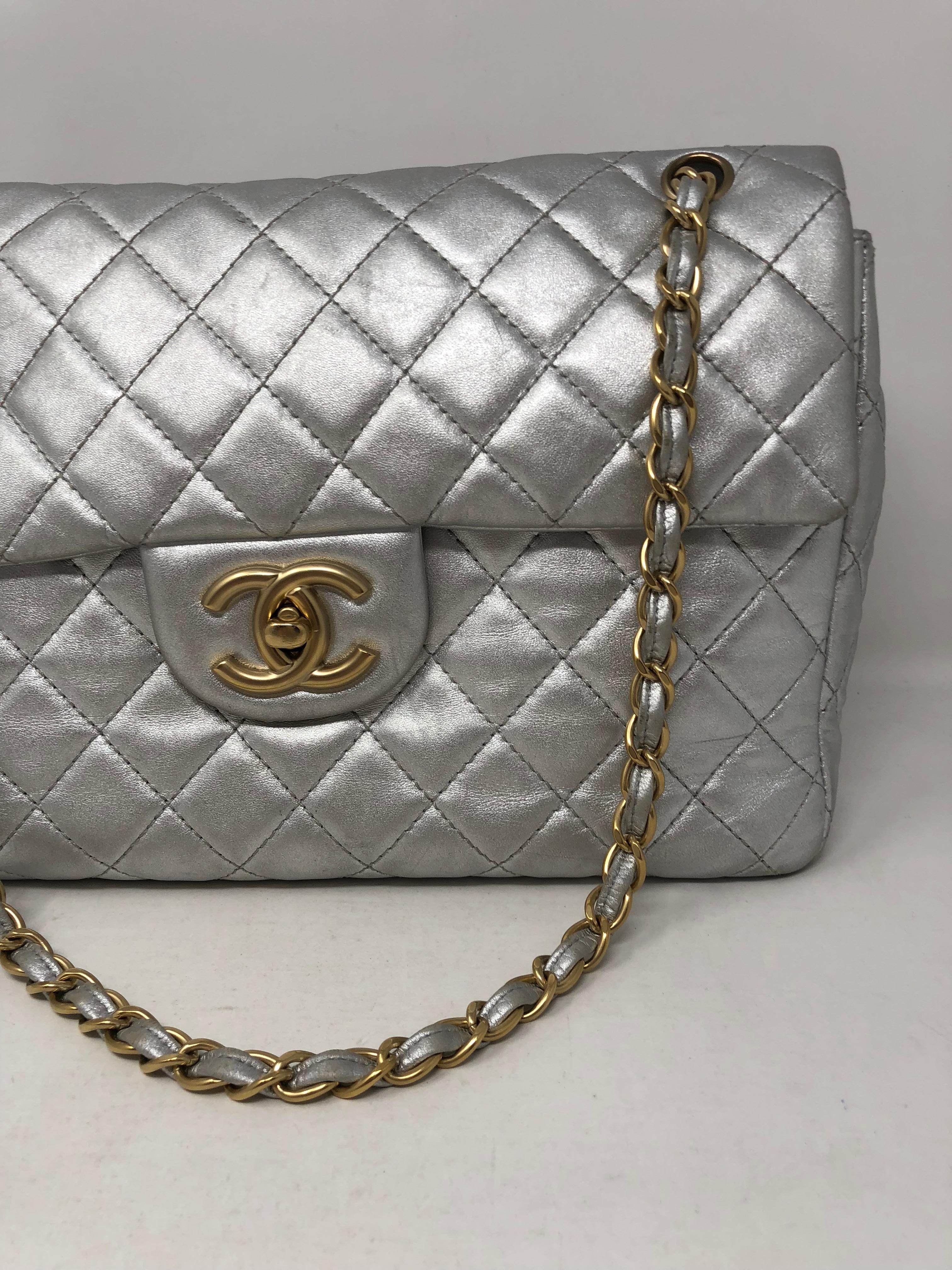 Chanel Silver Metallic Jumbo Bag. Gold hardware. Rare combo and hard to find silver leather bag. Celebrity owned and worn for many photo shoots. Does have wear but lots of life left. Please check all the pictures. Guaranteed authentic. 