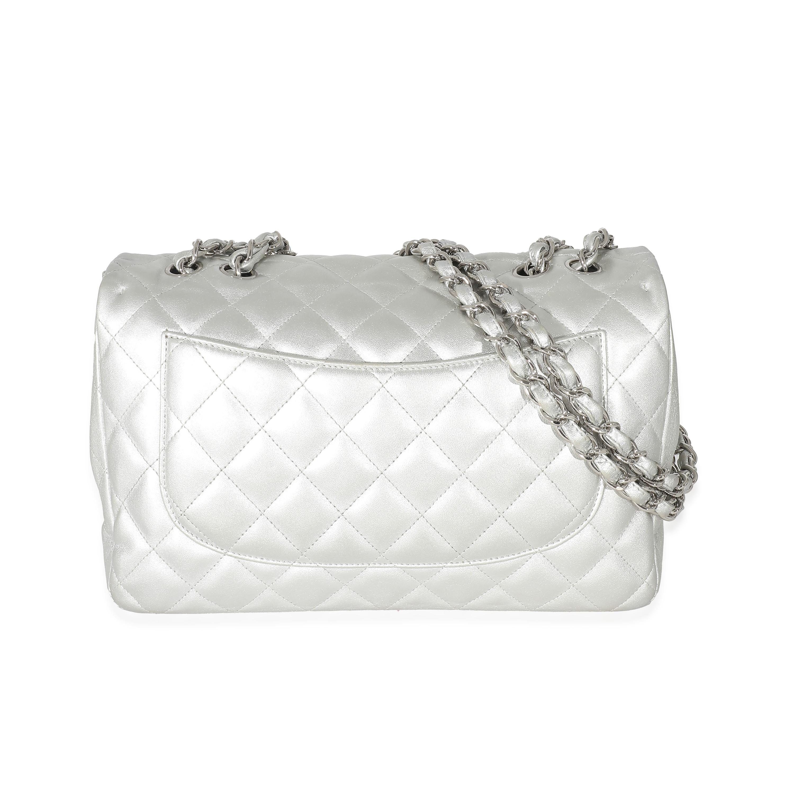 Listing Title: Chanel Silver Metallic Lambskin Jumbo Single Flap Bag
SKU: 133747
Condition: Pre-owned 
Condition Description: A timeless classic that never goes out of style, the flap bag from Chanel dates back to 1955 and has seen a number of