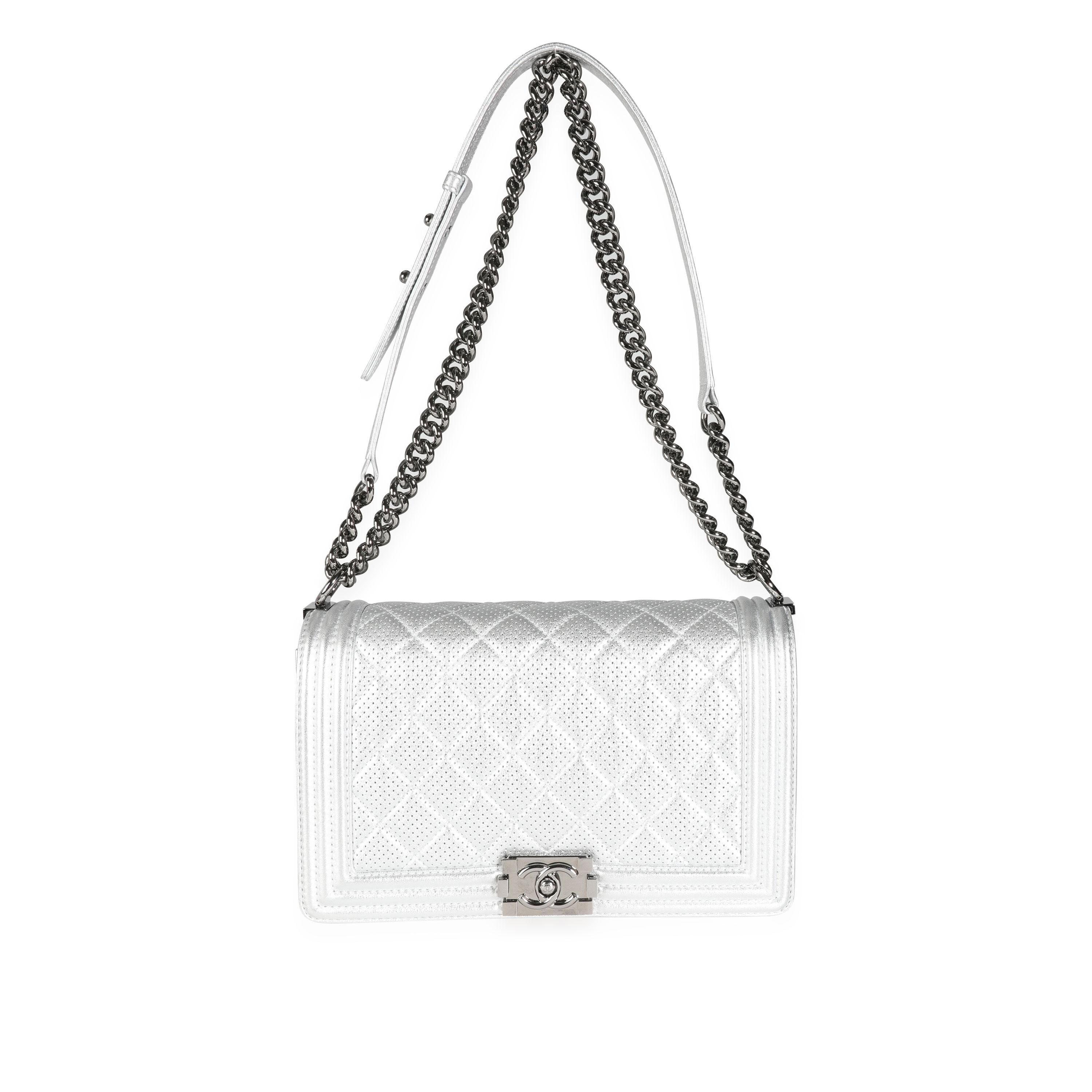 Listing Title: Chanel Silver Metallic Perforated Lambskin Large Boy Bag
SKU: 115454
Condition: Pre-owned (3000)
Handbag Condition: Excellent
Condition Comments: Excellent Condition. Hairline scratches to hardware. No other visible signs of
