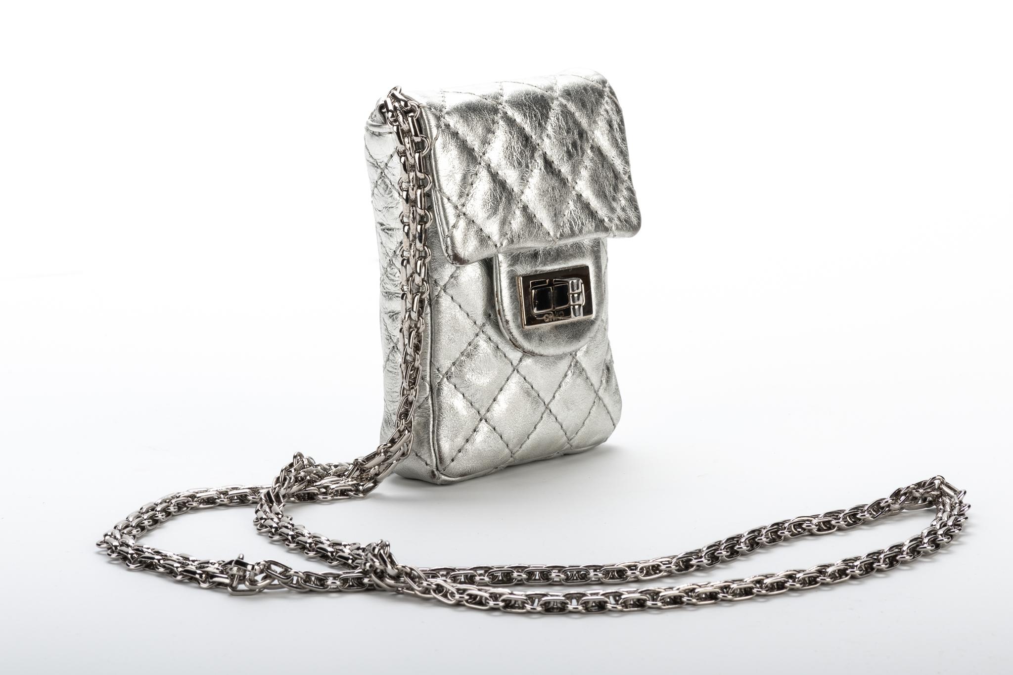 Chanel mini reissue silver cross body bag.  Super limited edition. Shoulder drop 24