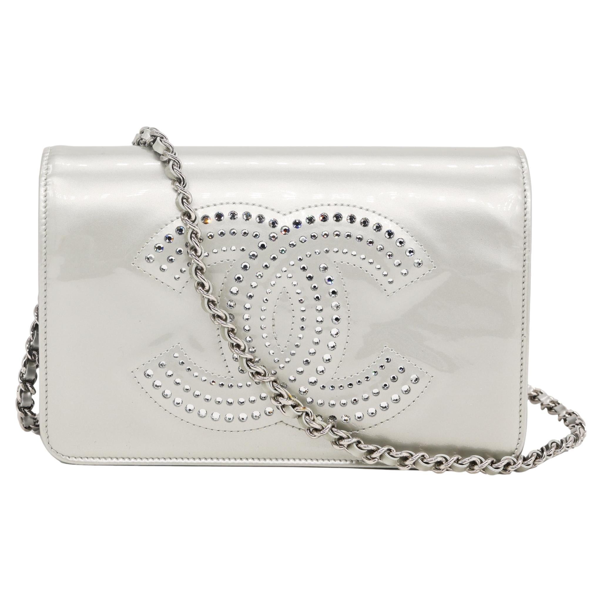 Chanel Silver Patent Leather and Rhinestone Embellishment Strass Wallet on Chain Clutch Crossbody Bag. Exceptionally made, this highly sought after and popular piece was produced between 2009 - 2010 under the direction of Karl Lagerfield baring a