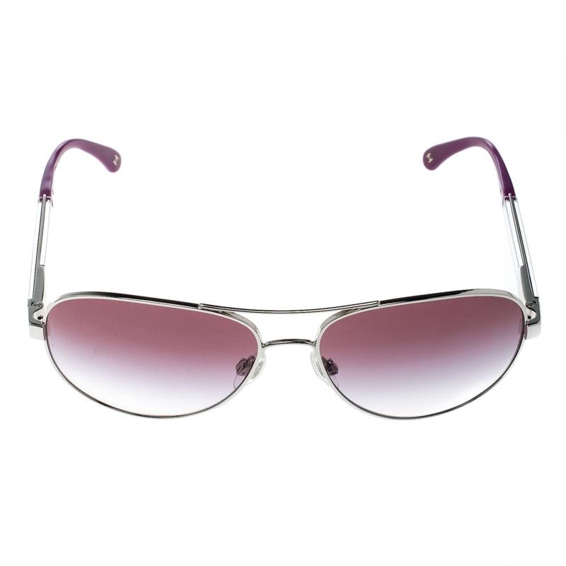 Styled to eloquently express your personal style, these Chanel sunglasses come in a silver metal frame with the brand name detailed on the temples. While its design will make you stand out, the purple lenses will provide sufficient