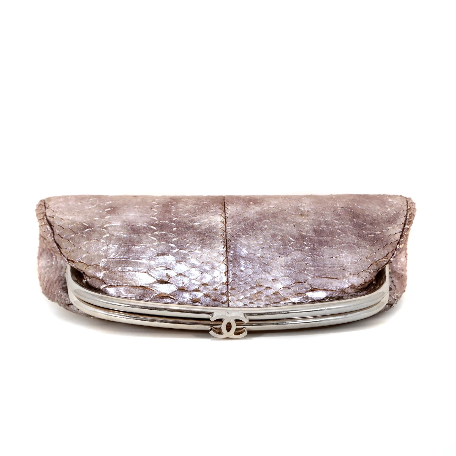 This authentic Chanel Silver Metallic Python Timeless Clutch is in very good condition.  It has enjoyed a previous life and has some slight curling on some of the scales.  
Striking metallic silver python with silver tone frame.  Interlocking CC