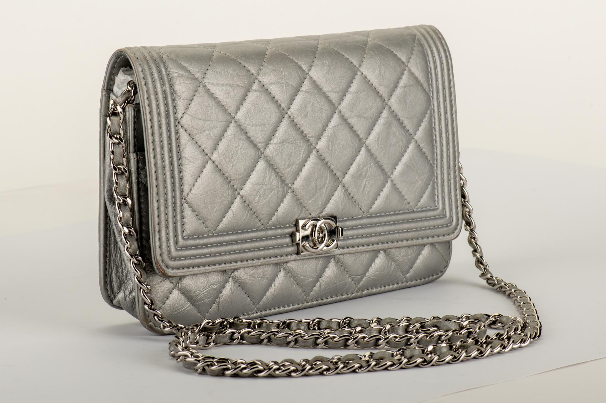 Chanel silver boy bag wallet on a chain cross body. Comes with hologram and  dust cover.