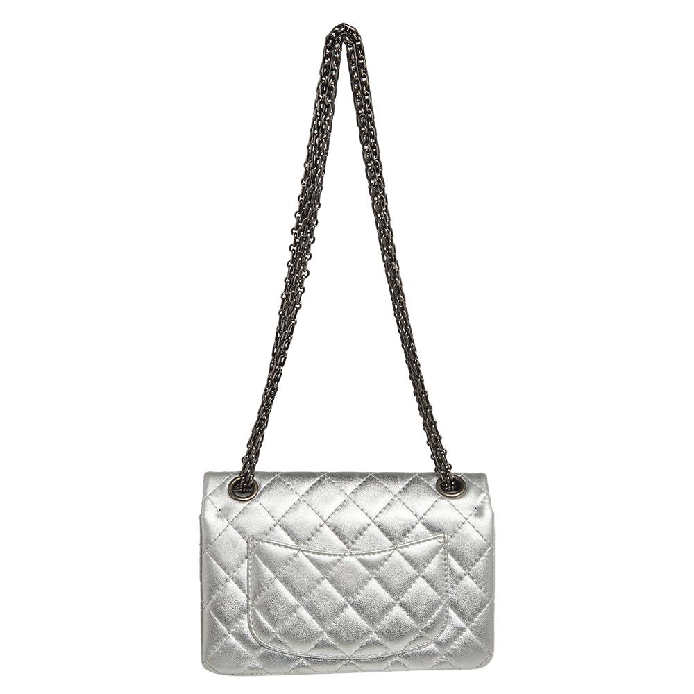 Introduce Chanel's irreplaceable style to your closet with this Reissue 2.55 Classic 224 flap bag. Crafted using leather, the silver bag has a signature quilted exterior, the Mademoiselle lock on the front, and a leather-lined interior. Complete