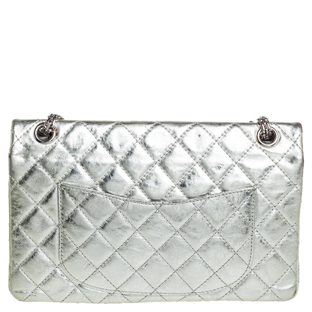 Chanel's Flap Bags are iconic and noteworthy in the history of fashion. Hence, this Reissue 2.55 Classic 226 is a buy that is worth every bit of your splurge. Exquisitely crafted from silver foil leather, it bears their signature quilt pattern and