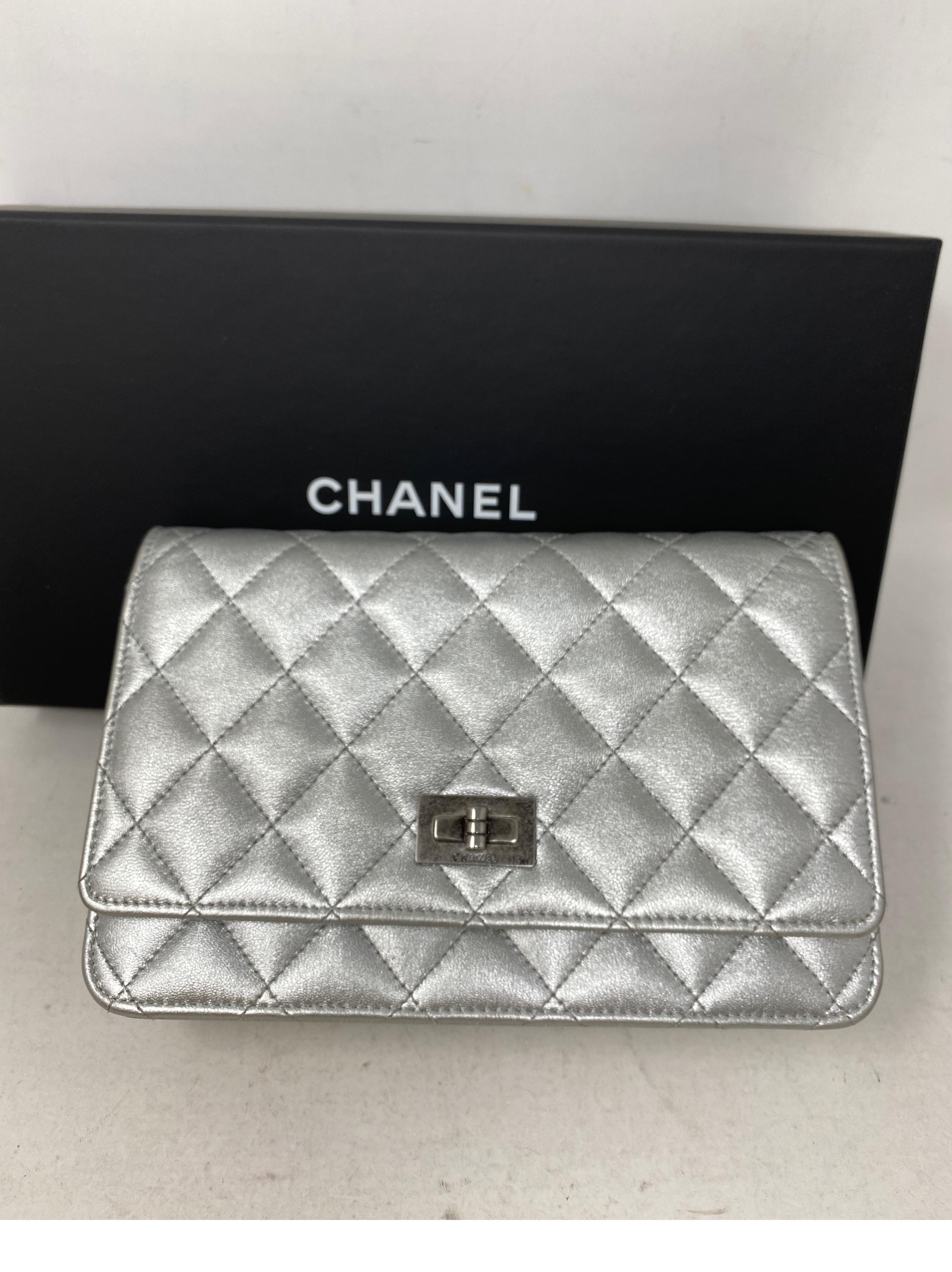 Chanel Silver Reissue Wallet On A Chain Bag. Ruthenium hardware. Metallic silver leather crossbody bag. Excellent like new condition. Can be worn as a clutch, crossbody or doubled as a shoulder bag. Great looking bag. Includes authenticity card and