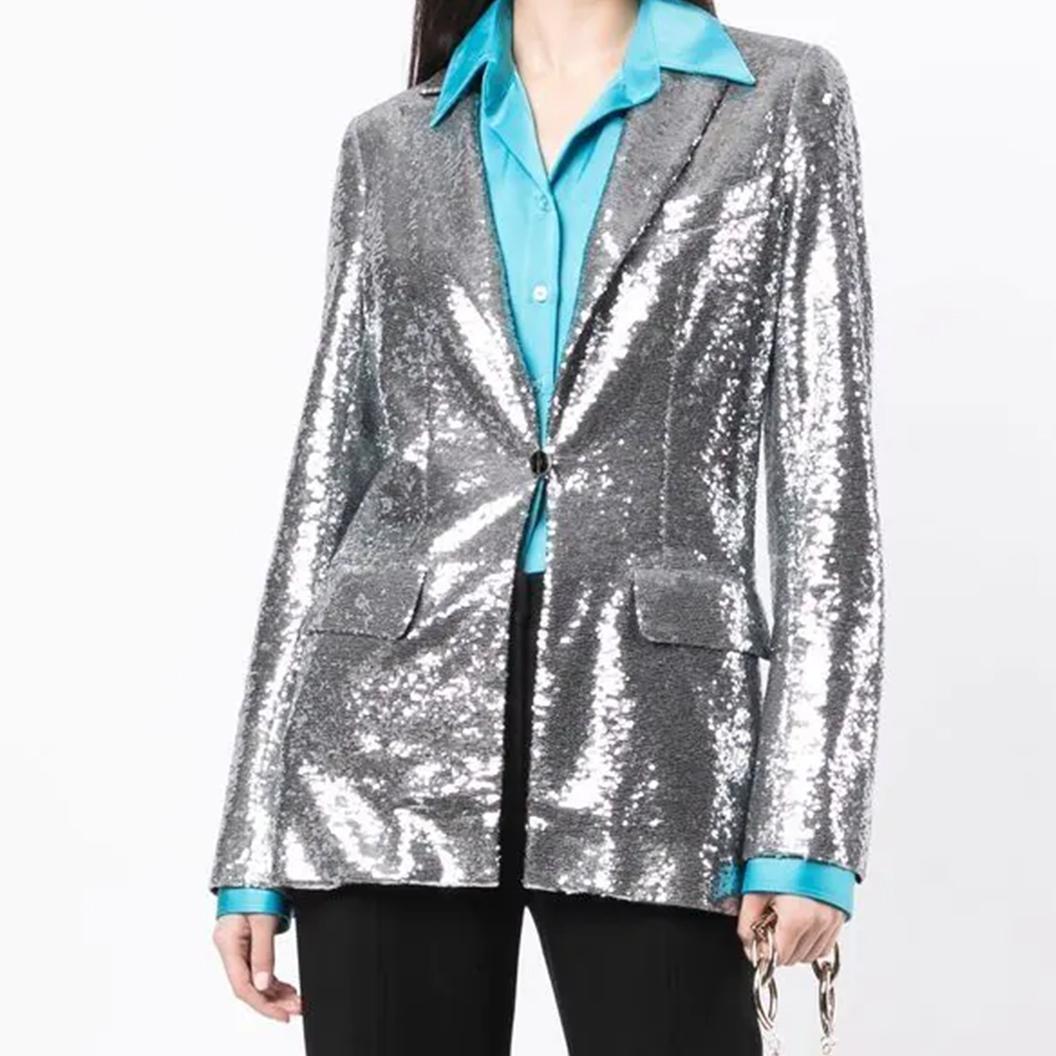 With no shortage of embellishments, this pre-owned sequin blazer from Chanel's 2009 Miami Cruise collection is a true showstopper. Beautifully tailored with silver sequins, the jacket has face-framing peak lapels and a silk interior with camellia