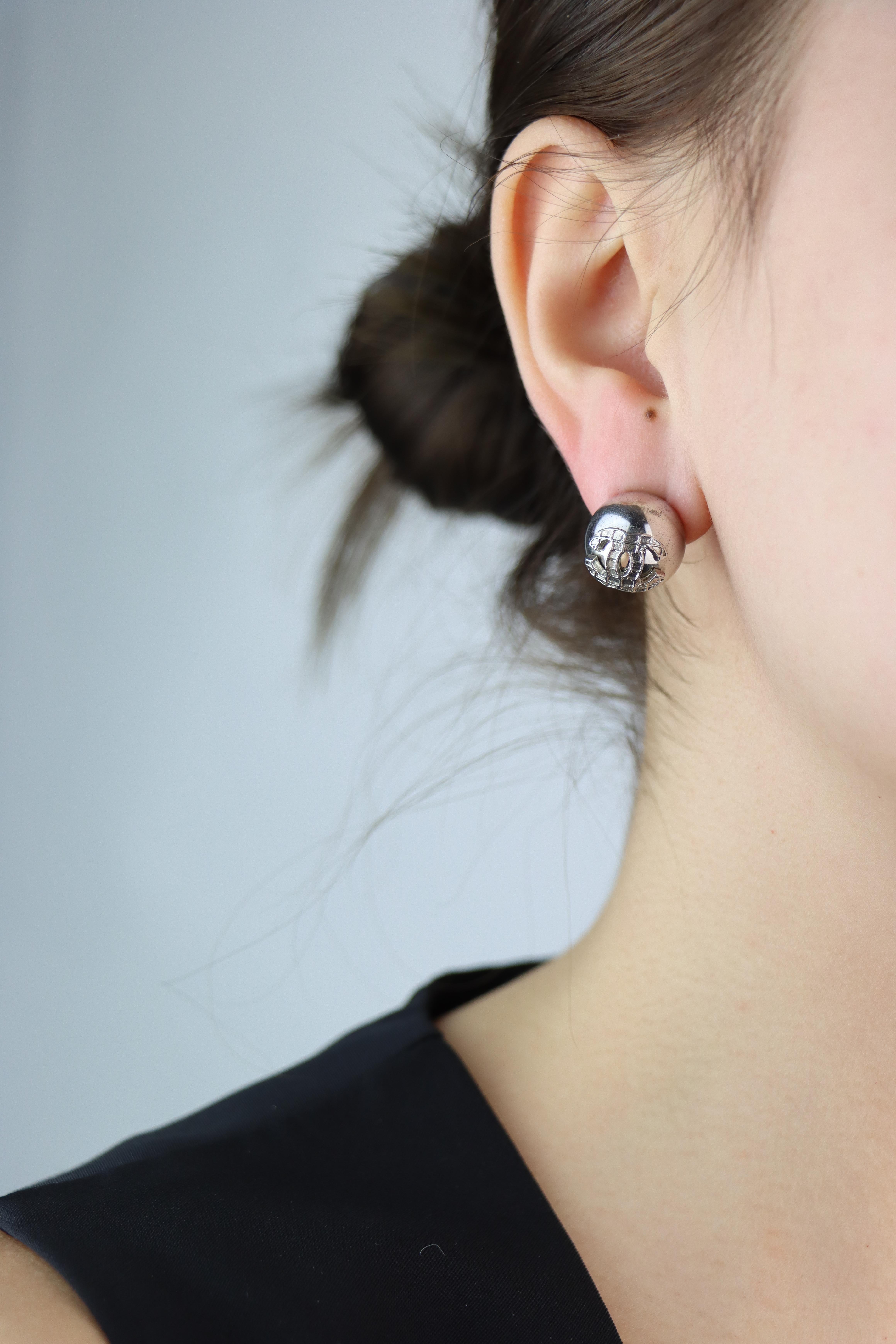Chanel Silver Tone Double C Logo Round Earring

Marked:
CHANEL
Made in France

Approximate Dimensions:
1.3 cm (Diameter) 
18.5 grams in weight.