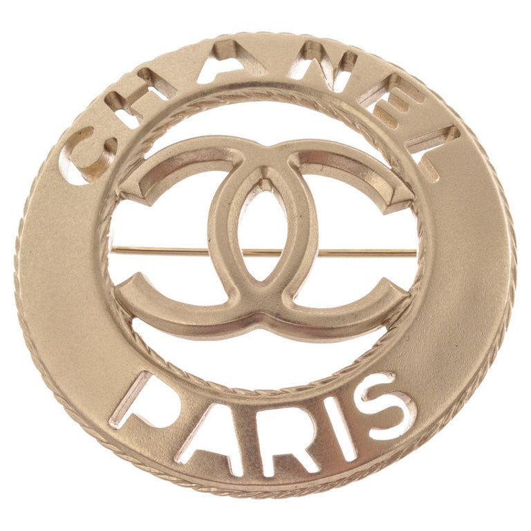 Chanel Silver-Tone Metal CC Paris Round Brooch For Sale at 1stDibs