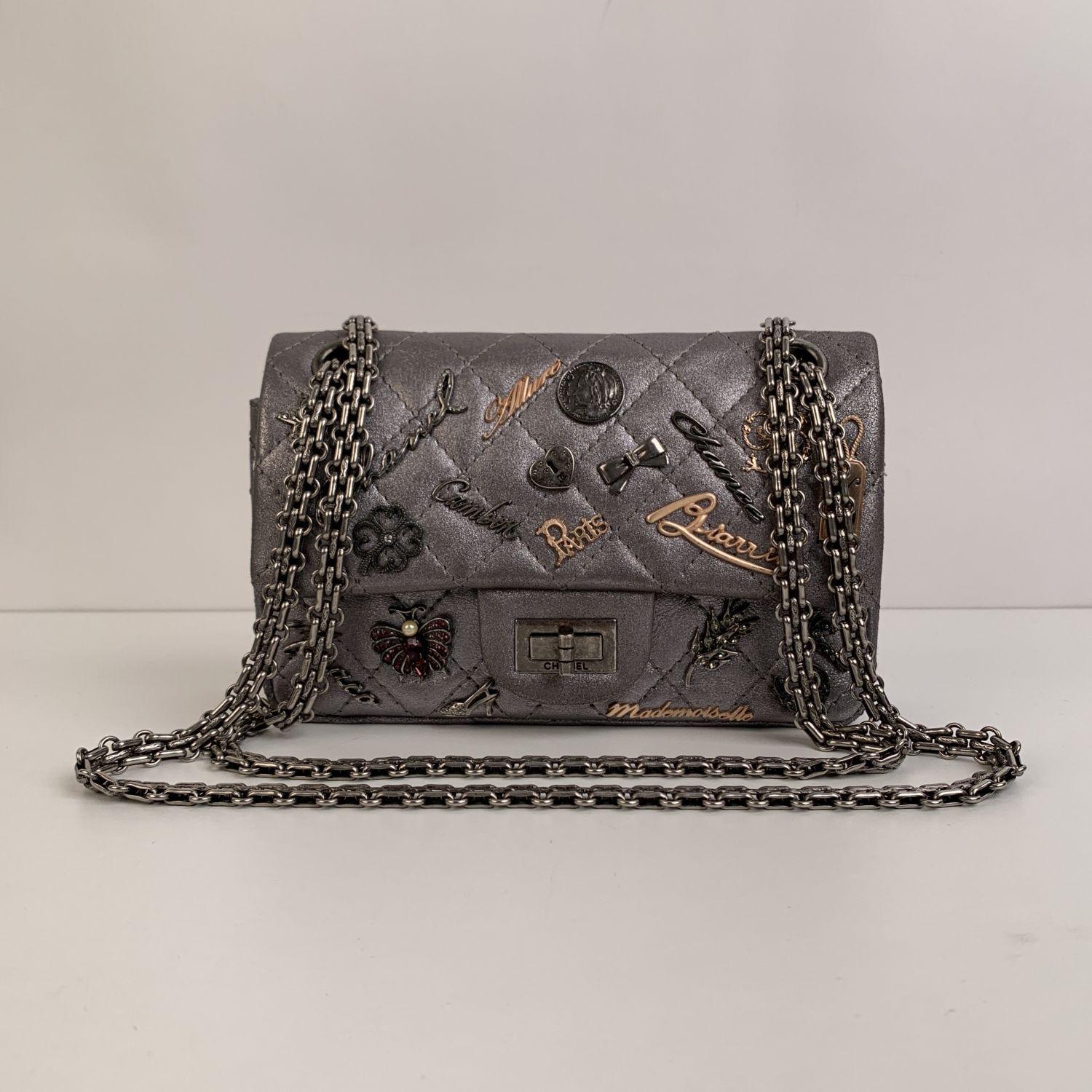 Beautiful Chanel '2.55 Reissue Flap Limited Edition - Lucky Charms' Shoulder Bag. The bag is crafted in silver-tone quilted leather embellished with different Chanel iconic metal charms applications. It features the Mademoiselle turnlock closure and
