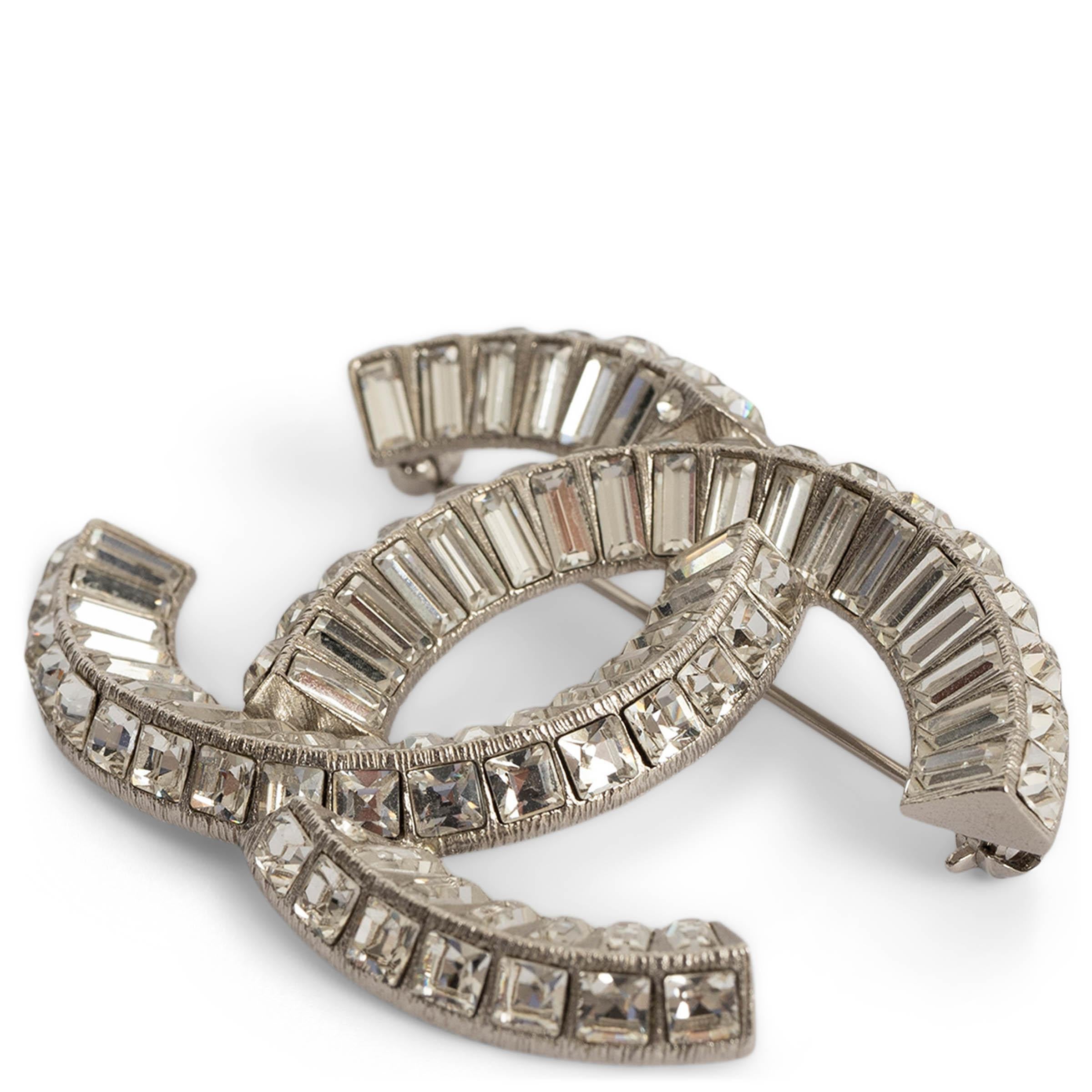100% authentic Chanel large CC brooch in silver-tone metal adorned with clear baguette crystals. Has been carried and is in excellent condition. 

REV Collection.

Measurements
Model	ChanelREV A63085 Y02003 Z3502
Width	5cm (2in)
Height	4cm