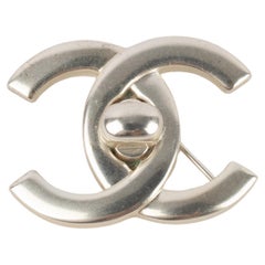 Chanel Silvery Metal Brooch Turnlock, 1996