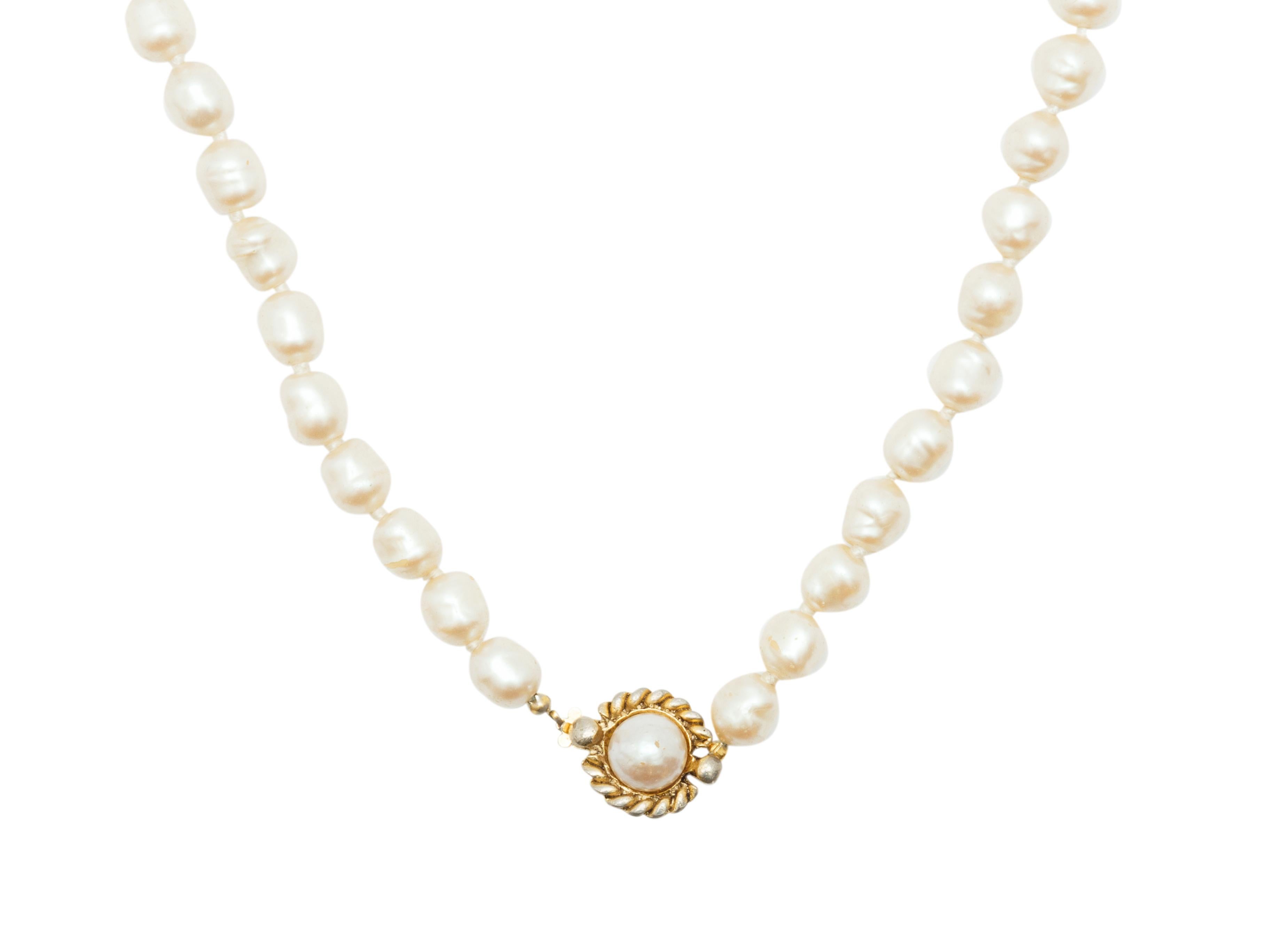 Product details:  Single faux pearl strand necklace by Chanel.  Clasp closure.  Goldtone hardware.  44