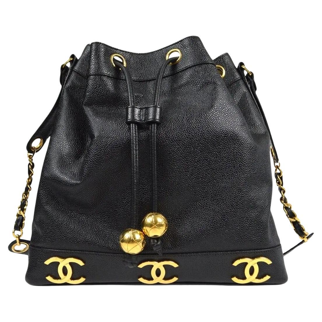 Chanel Six CC Caviar Leather Draw String Pendant Shoulder bag/ Backpack.
Beautiful Caviar leather bag with gold accents. 
The caviar leather is in excellent condition. The drawstring is made from the same leather and extend around the top of the bag