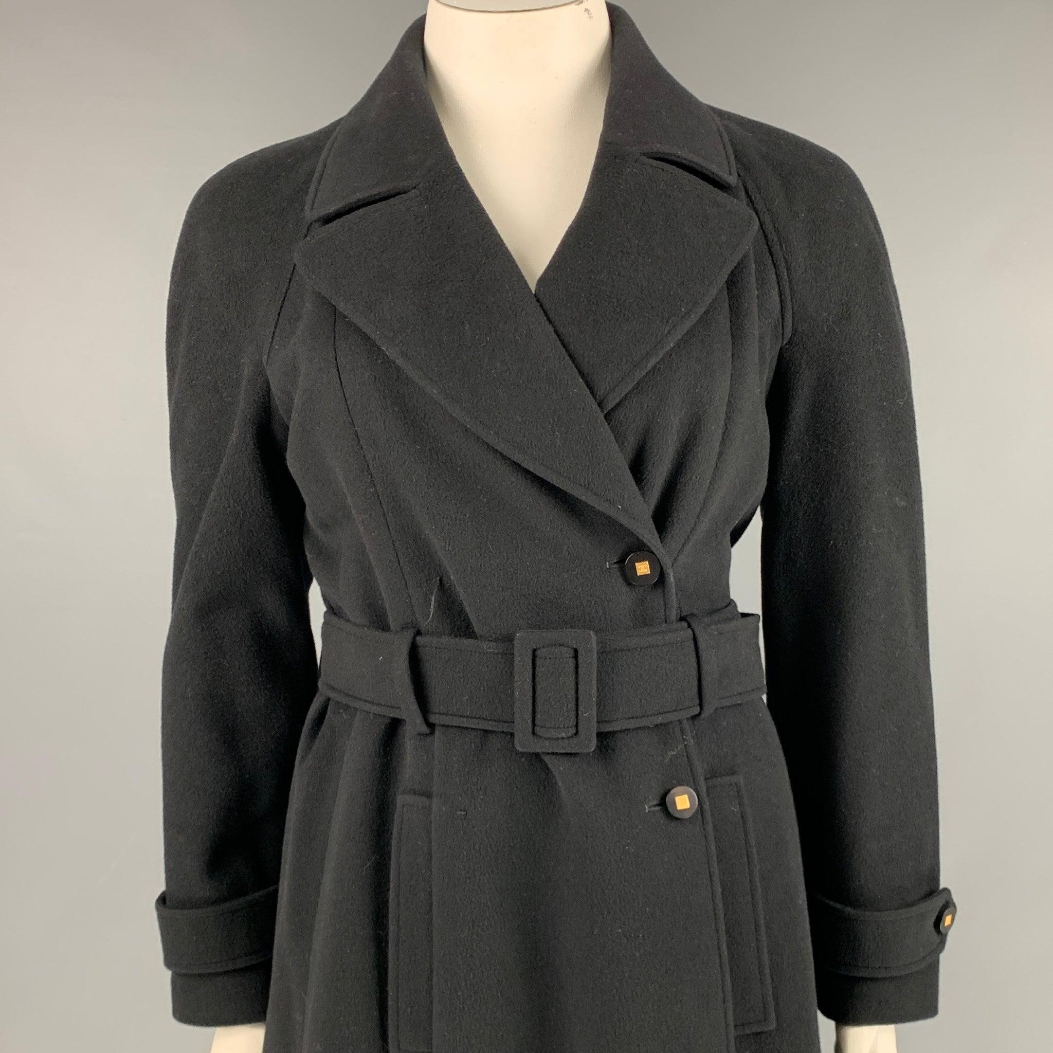 Vintage CHANEL 1996 coat
in a
black cashmere fabric with silk lining featuring a single breasted style, gold tone hardware, and belt. Made in France.Very Good Pre-Owned Condition. Minor marks. 

Marked:   FR 42 

Measurements: 
 
Shoulder: 18.5