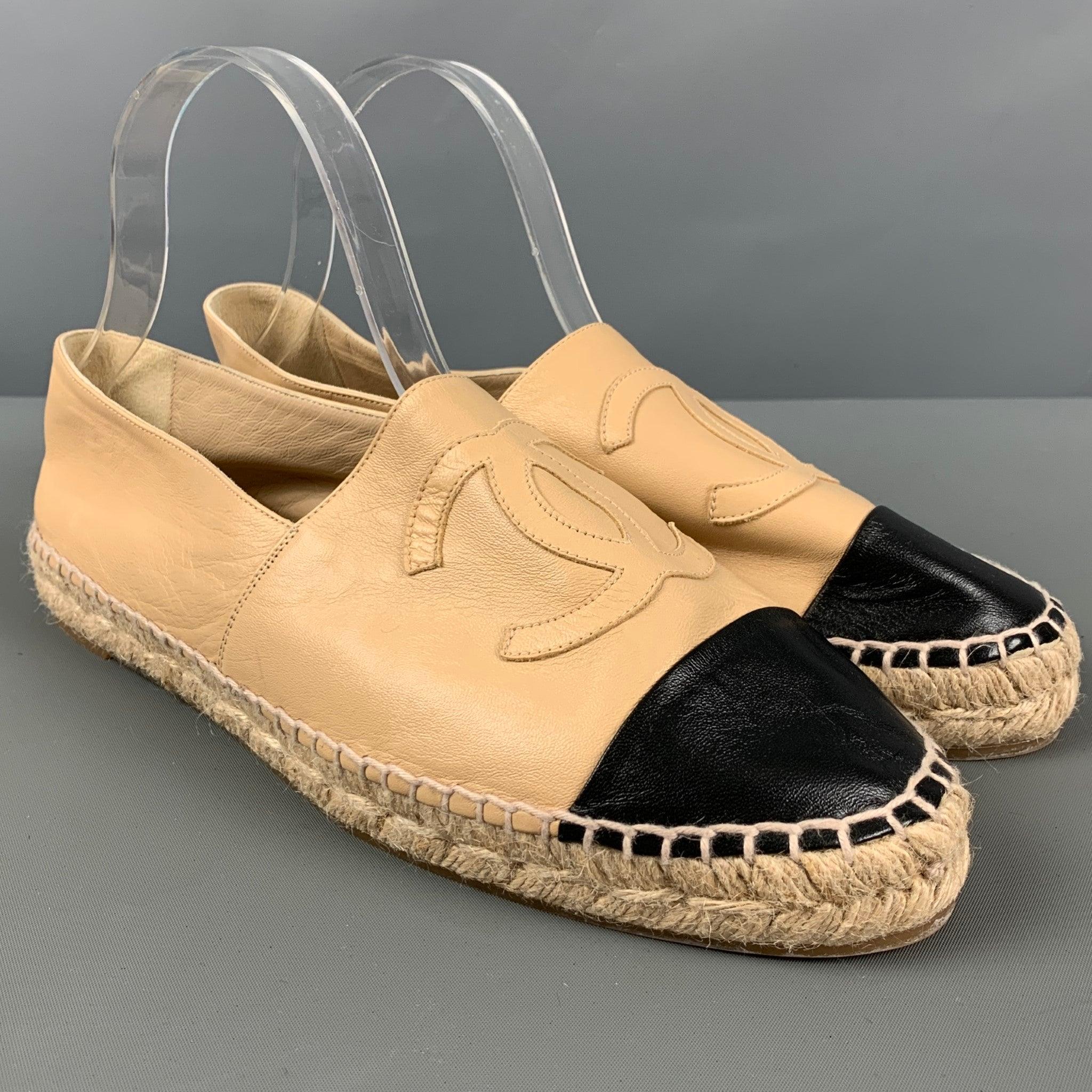 CHANEL flats
in a beige lambskin leather featuring signature logo, black contrast cap toe, and an espadrille sole.New without box. 

Marked:   M G29762Outsole:10.75 inches  x 3.5 inches 
  
  
 
Reference: 126612
Category: Flats
More Details
   