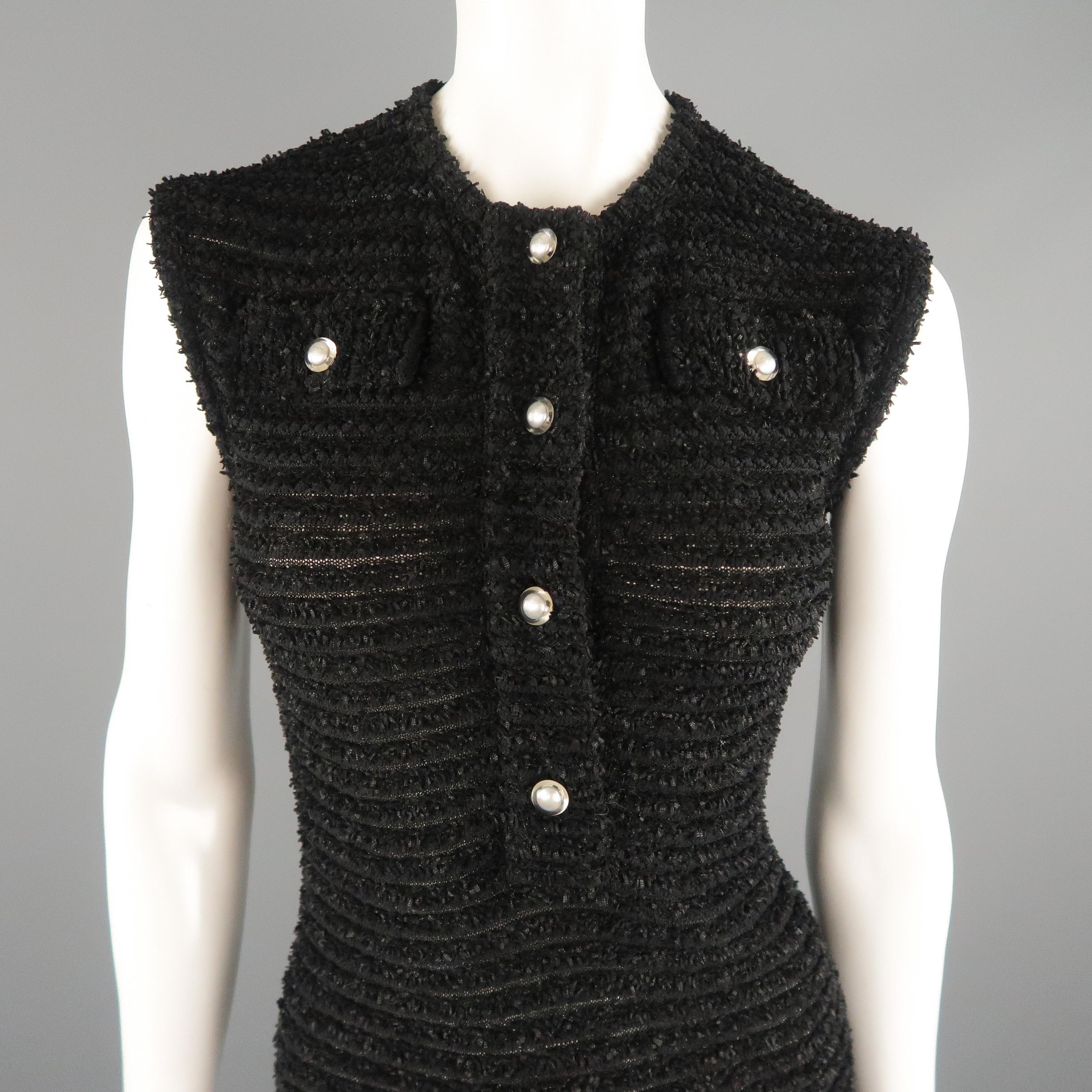 CHANEL shift dress comes in burnout striped textured tweed knit with a scoop neckline, flaired skirt, flap pockets, and half button closure with clear faux pearl CC buttons. Made in Italy.
 
Excellent Pre-Owned Condition.
Marked: FR 46

