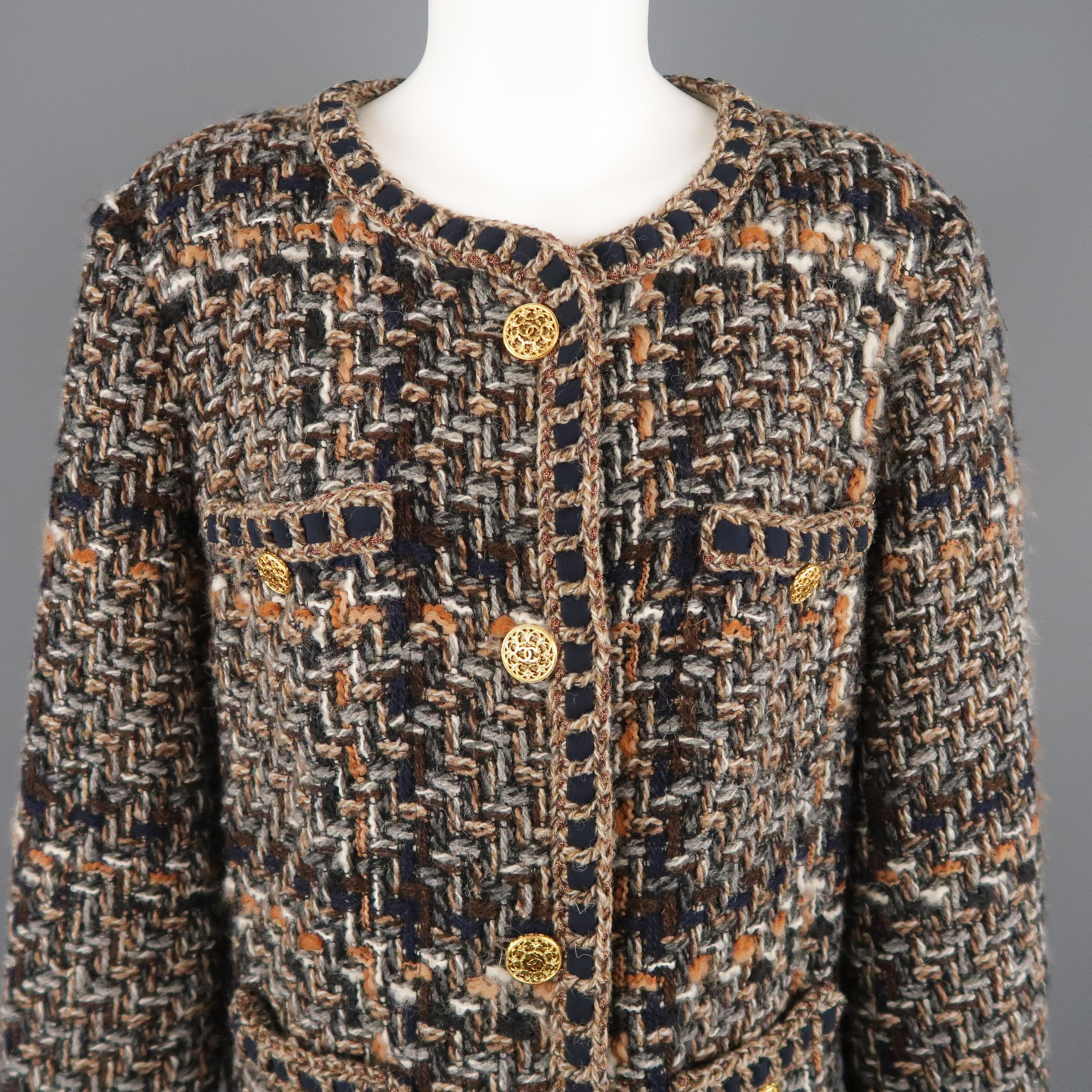 CHANEL winter jacket comes in chunky textured taupe wool blend tweed with hues of browns, grays, and navy throughout,  yellow gold tone metal CC emblem cutout statement buttons, round, collarless neckline, frontal slit button pockets, navy silk