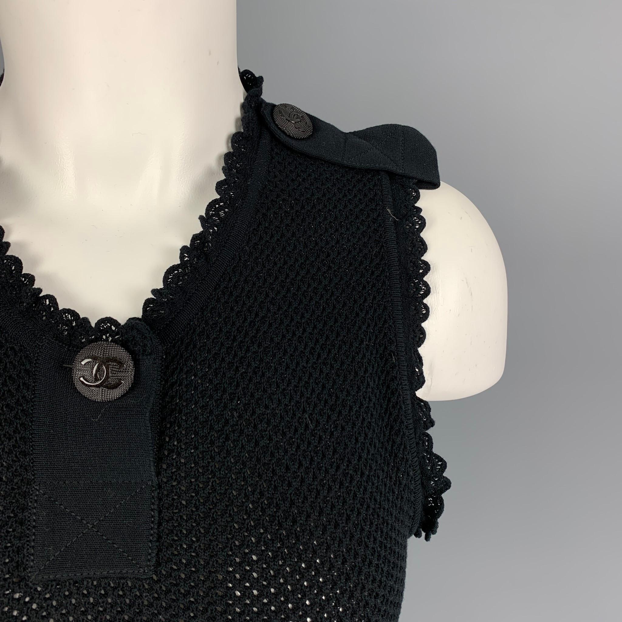 CHANEL dress comes in a black knitted stretch cotton featuring a fit & flare style, sleeveless, epaulettes, and logo button details. Made in France. 

Very Good Pre-Owned Condition.
Marked: 94305 34

Measurements:

Shoulder: 12 in.
Bust: 26