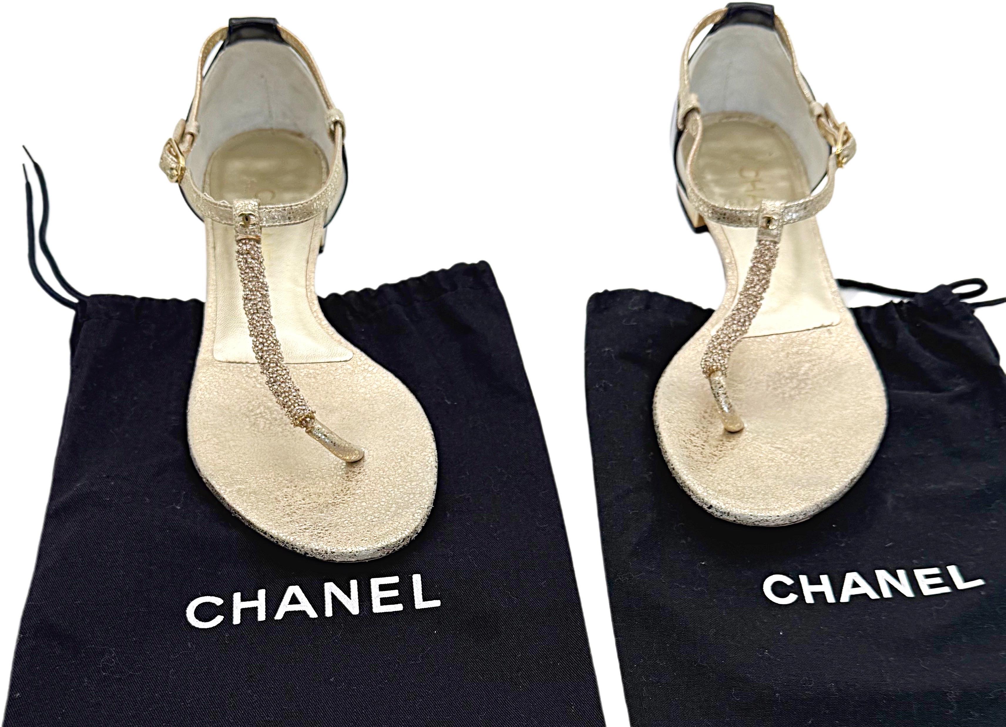 Chic Chanel gold and black beaded leather thong sandals ! Only worn once, with slight wear to the soles. Gold seed beads up the center strap. Gold CC metal logo plate at center ankle. Adjustable leather straps. Black patent leather back with gold