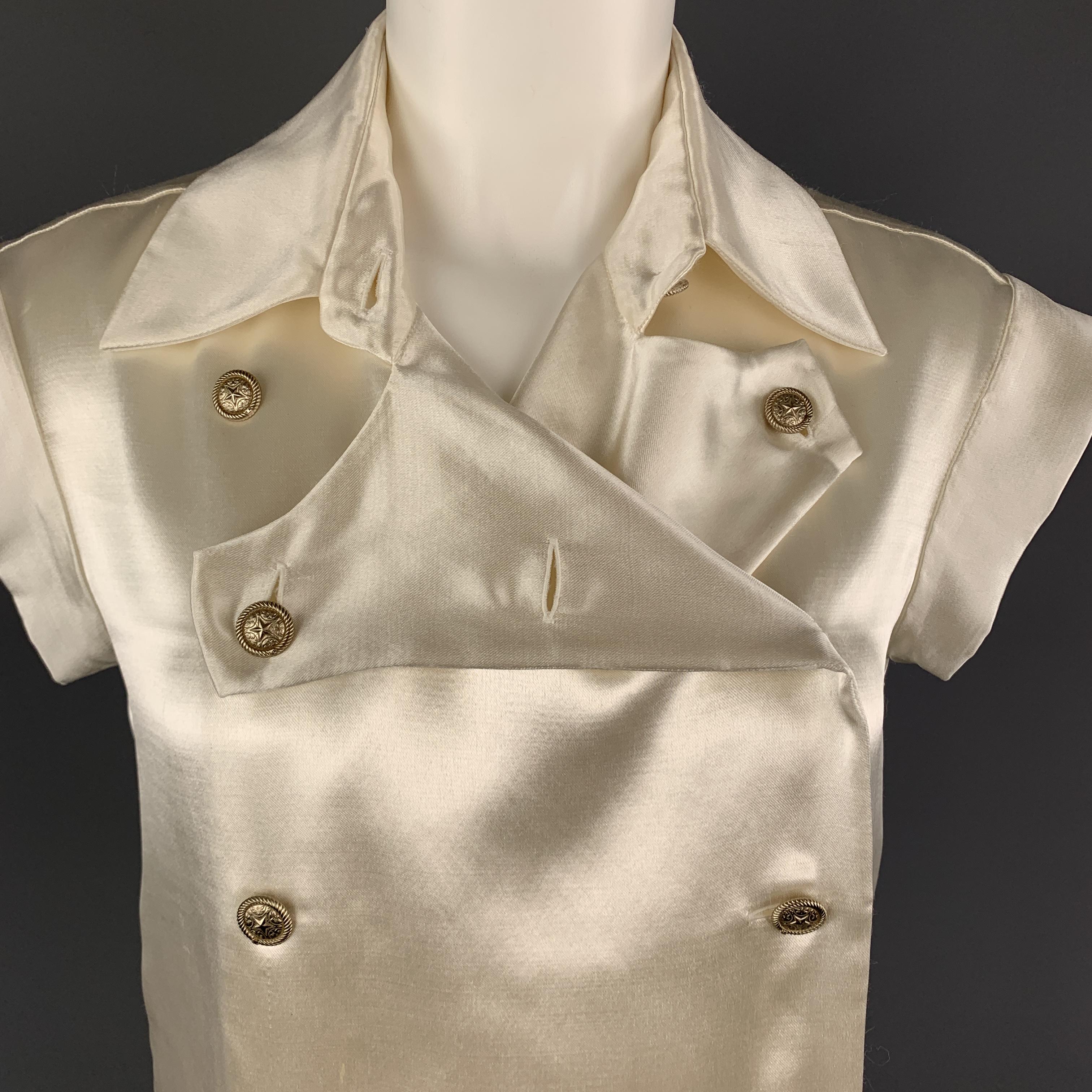 CHANEL blouse comes in an acetate wool silk blend sateen with a pointed collar, double breasted front with silver tone star buttons and band sleeves. Wear throughout satin. As-is. Made in France.

Good Pre-Owned Condition.
Marked: IT