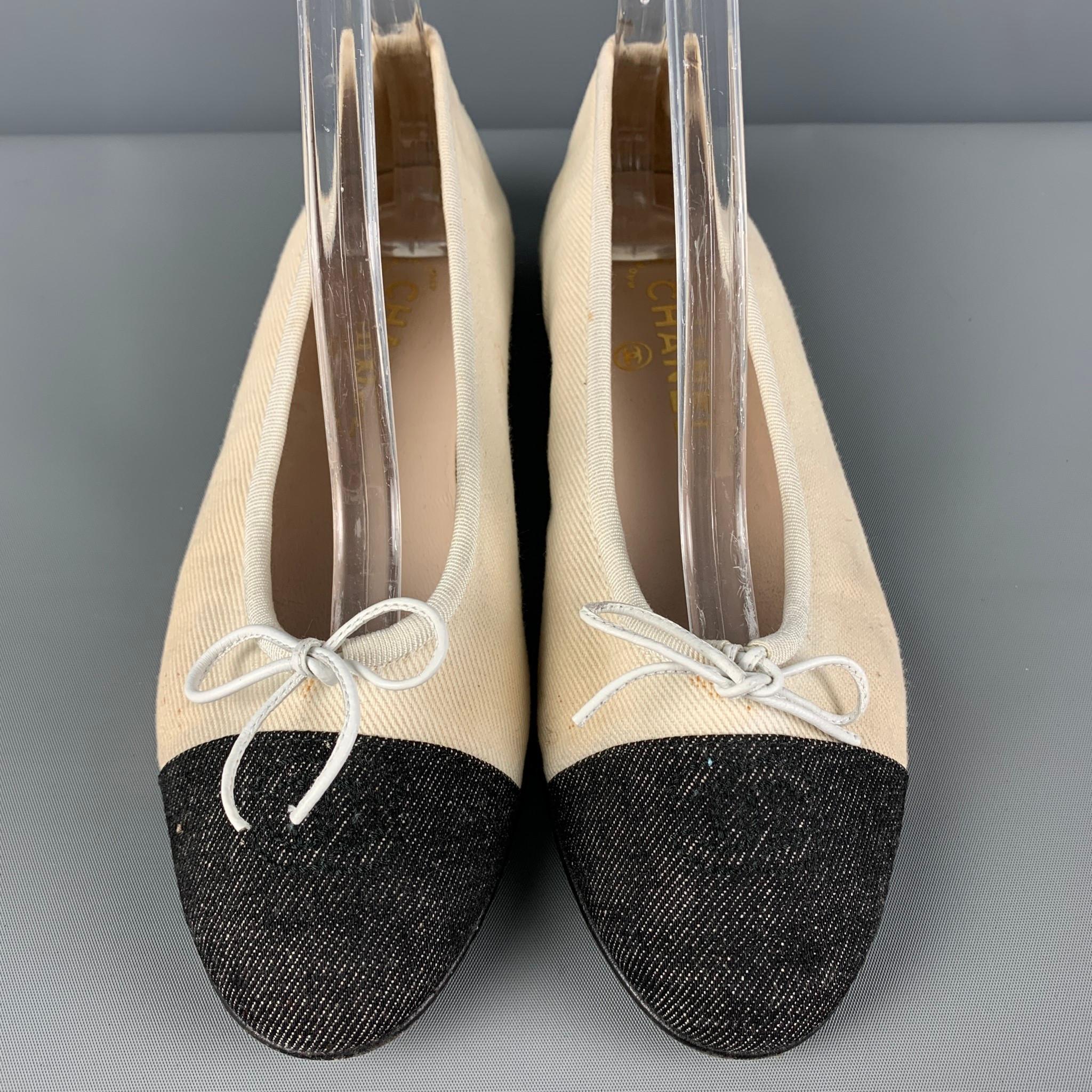 CHANEL flats comes in a cream denim with a black toe featuring a ballet style and a leather bow design. Made in Italy. 

Good Pre-Owned Condition. Moderate wear and discoloration. As-is.
Marked: 36.5

Measurements:

Outsole: 9.5 in. x 3 in.