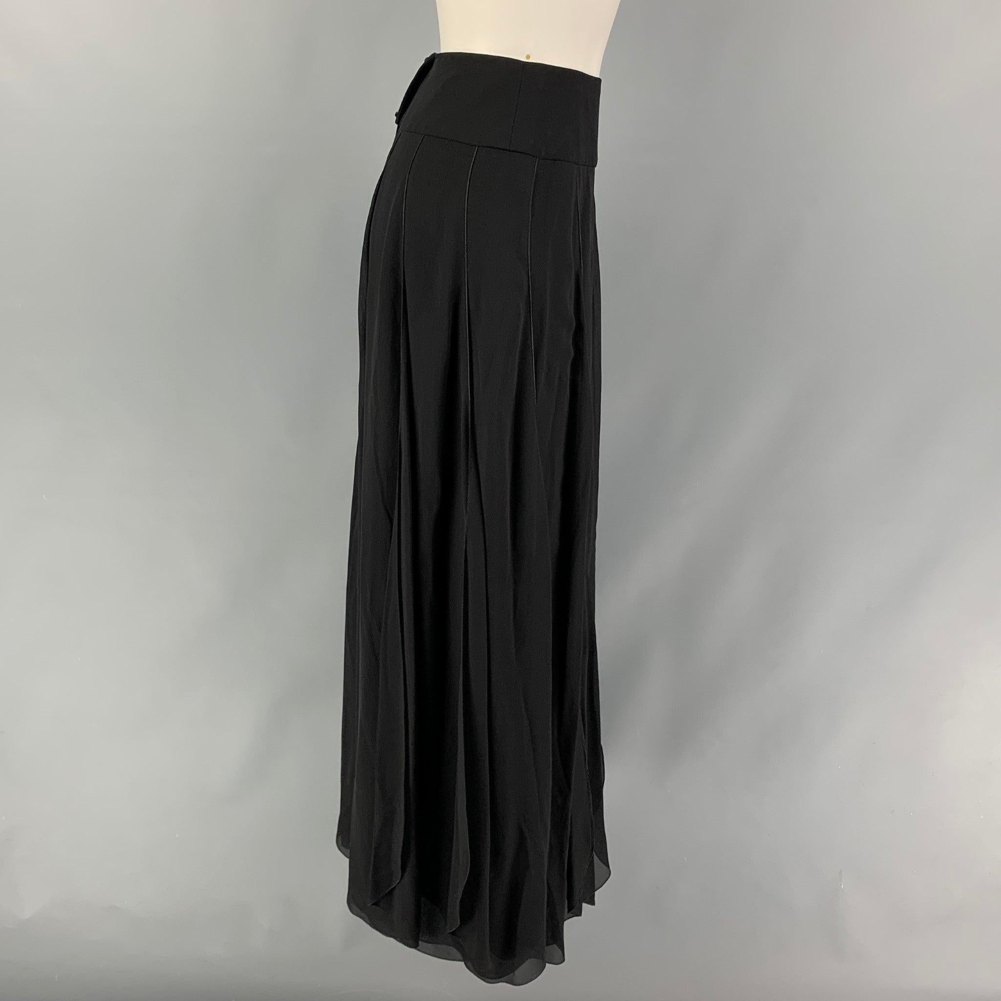 CHANEL 2000 skirt comes in a black silk featuring a pleated style, front & back high slit, and a back buttoned closure. Made in France.
Very Good
Pre-Owned Condition. 

Marked:   00S / 94305 38 

Measurements: 
  Waist: 26 inches  Hip: 32 inches 