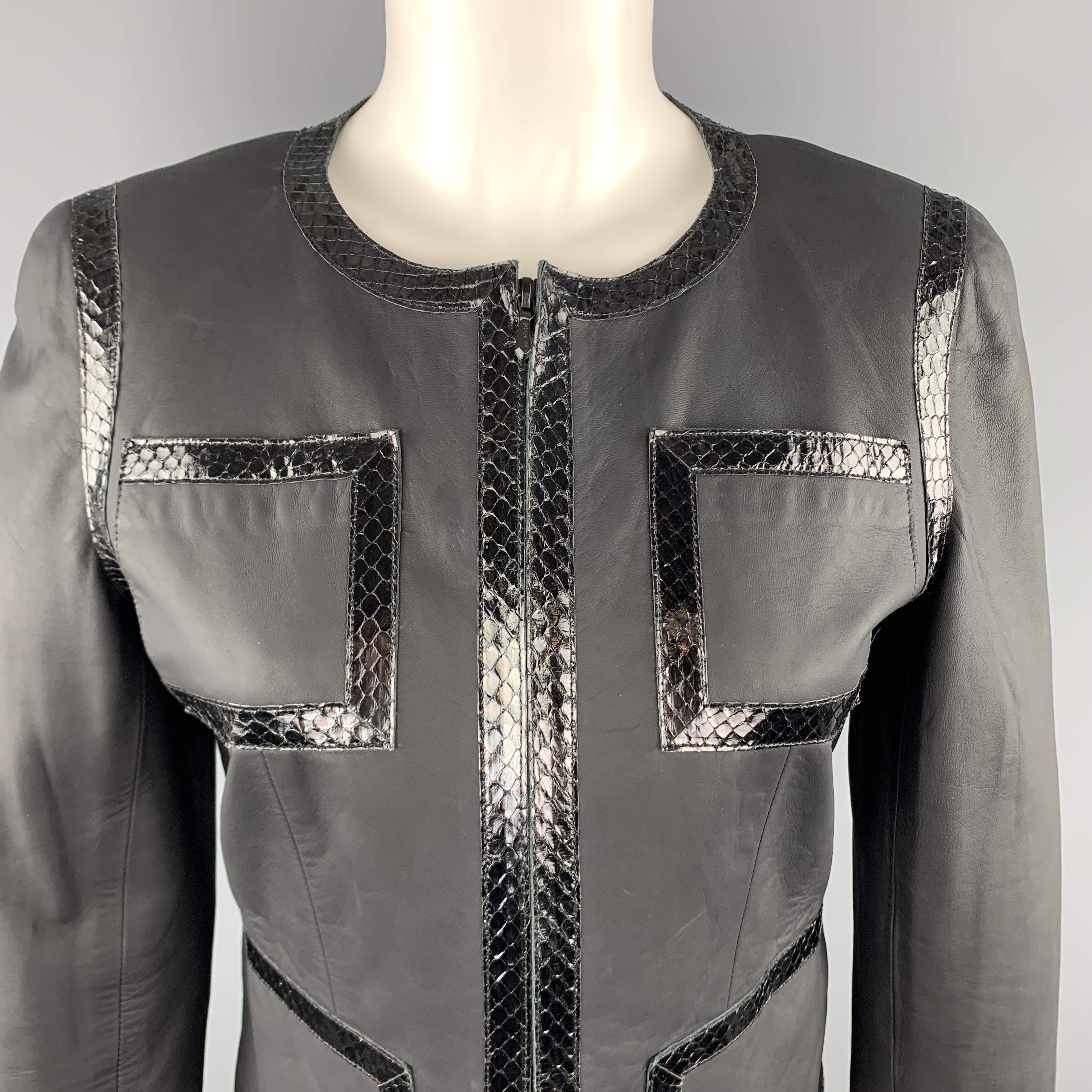 CHANEL Spring 2004 jacket comes in smooth matte leather with a collarless Coco Chanel classic cropped silhouette, zip front, patch pockets, slit cuff sleeves, and black snake leather trim. Minor wear. As-is. Made in France.

Very Good Pre-Owned