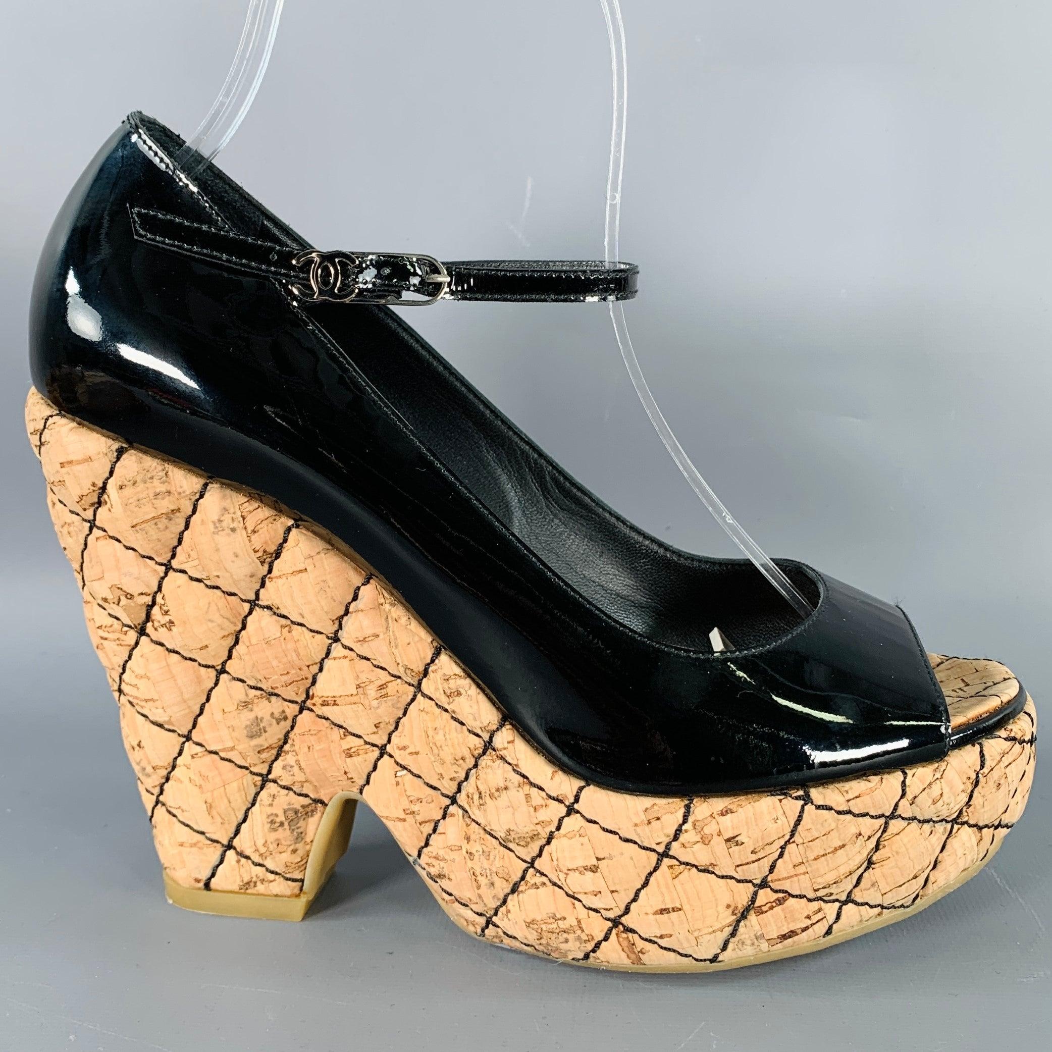 CHANEL platform pumps
in a black patent leather featuring natural quilted cork platform heel, peep toe, and ankle strap closure with logo detail. Comes with dust bag.Very Good Pre-Owned Condition. 

Marked:   size not marked 

Measurements: 
  Heel: