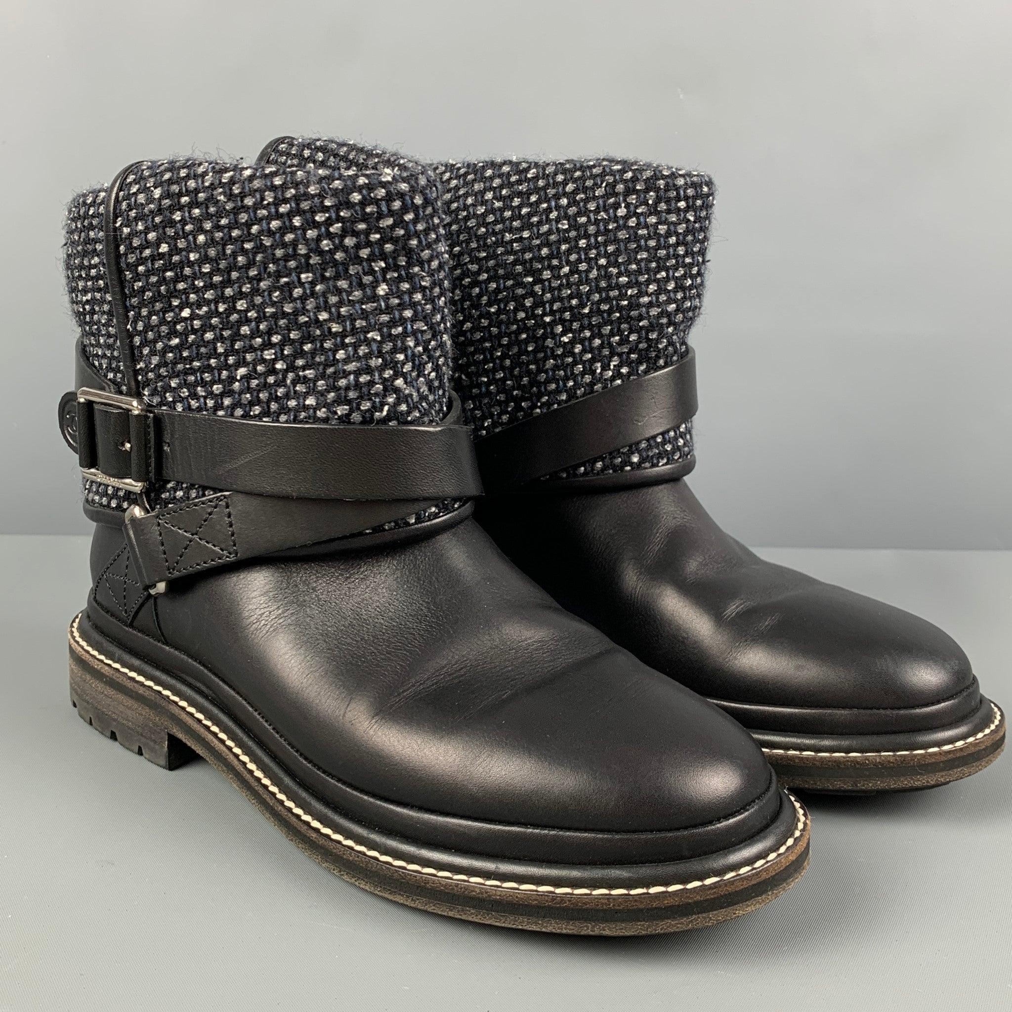 CHANEL boots comes in a black & grey mixed materials featuring a pull on style, contrast stitching, logo details, and a buckle strap closure.
Very Good
Pre-Owned Condition. 

Marked:   37.5 

Measurements: 
  Length: 10.75 inches  Width: 3.75 inches